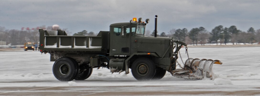 LANGLEY AIR FORCE BASE, Va.-- The 1st Civil Engineering Squadron works to clear the flightline after a snowstorm March 2. Langley was hit with parts of the largest  snowfall Virginia has seen in the last three years. (U.S. Air Force photo/Airman Rebecca Montez)