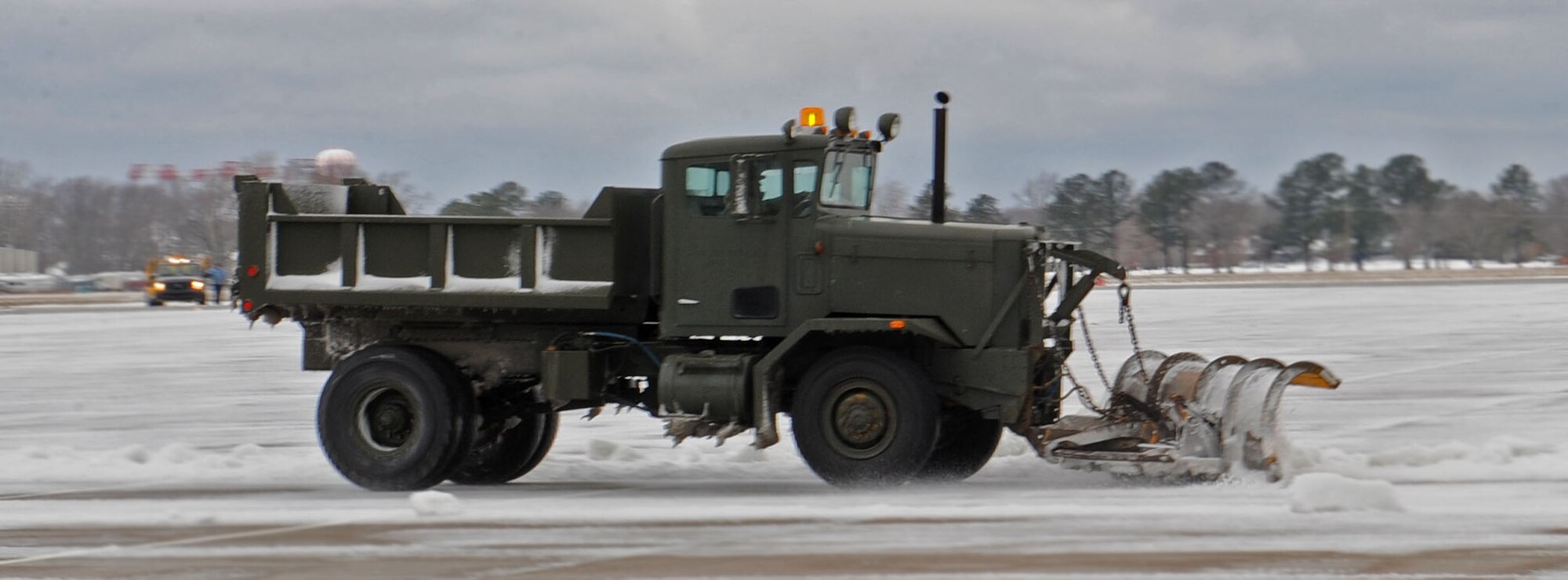 LANGLEY AIR FORCE BASE, Va.-- The 1st Civil Engineering Squadron works to clear the flightline after a snowstorm March 2. Langley was hit with parts of the largest  snowfall Virginia has seen in the last three years. (U.S. Air Force photo/Airman Rebecca Montez)