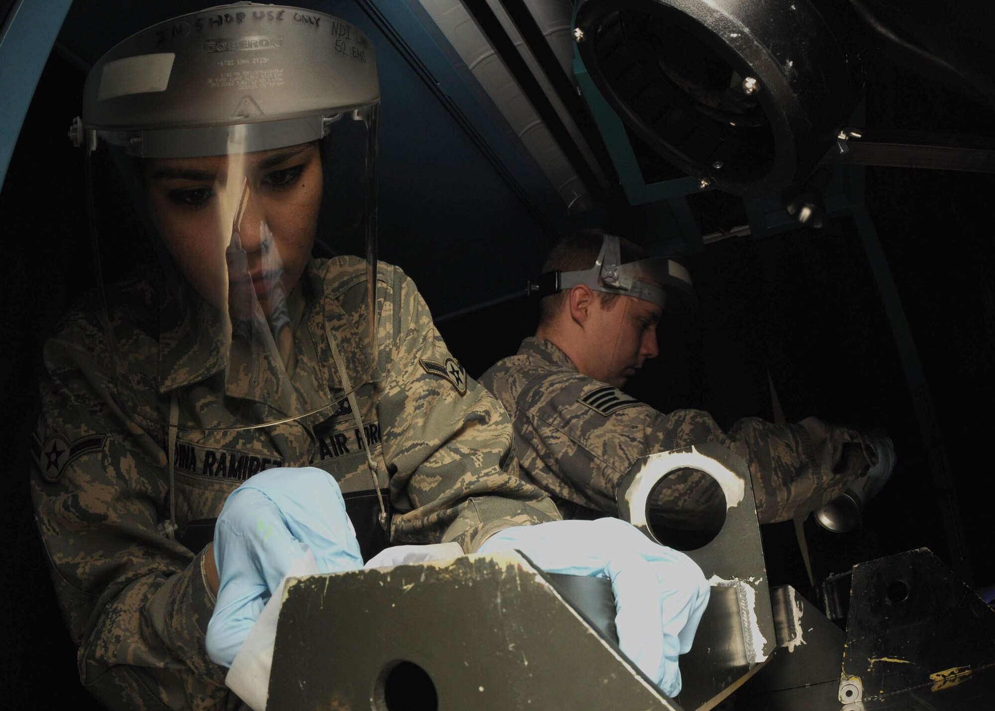 SPANGDAHLEM AIR BASE, Germany – Airman Juliana Medina Ramirez, 52nd Equipment Maintenance Squadron, performs a penetrant inspection on egress parts, Feb. 23, 2009 in the equipment maintenance shop. This is done to help inspectors find critical errors that could lead to engine failure. (U.S. Air Force photo by Airman 1st Class Nicholas Wilson)

