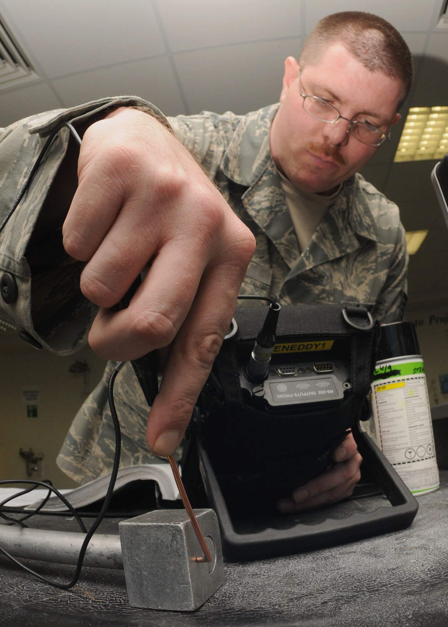SPANGDAHLEM AIR BASE, Germany -- Tech Sgt. John Wood, 52nd Equipment Maintenance Squadron, uses Eddy Current to inspect a raisebar, Feb. 23, 2009 in the equipment maintenance shop. This is done to detect potential aircraft engine failure. (U.S. Air Force photo by Airman 1st Class Nicholas Wilson)