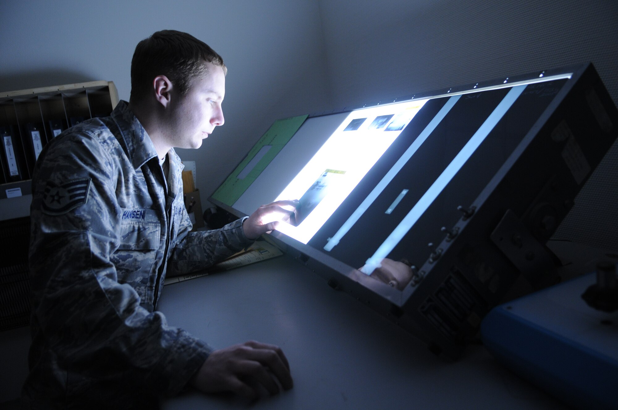 SPANGDAHLEM AIR BASE, Germany –Staff Sgt. Andrew Hanson, 52nd Equipment Maintenance Squadron, reviews x-ray film to ensure the extractor tube is properly installed in the main engine controller, Feb. 23, 2009 in the equipment maintenance shop. This is done to keep units standardized and so aircraft engine failure can be detected. (U.S. Air Force photo by Airman 1st Class Nicholas Wilson)


