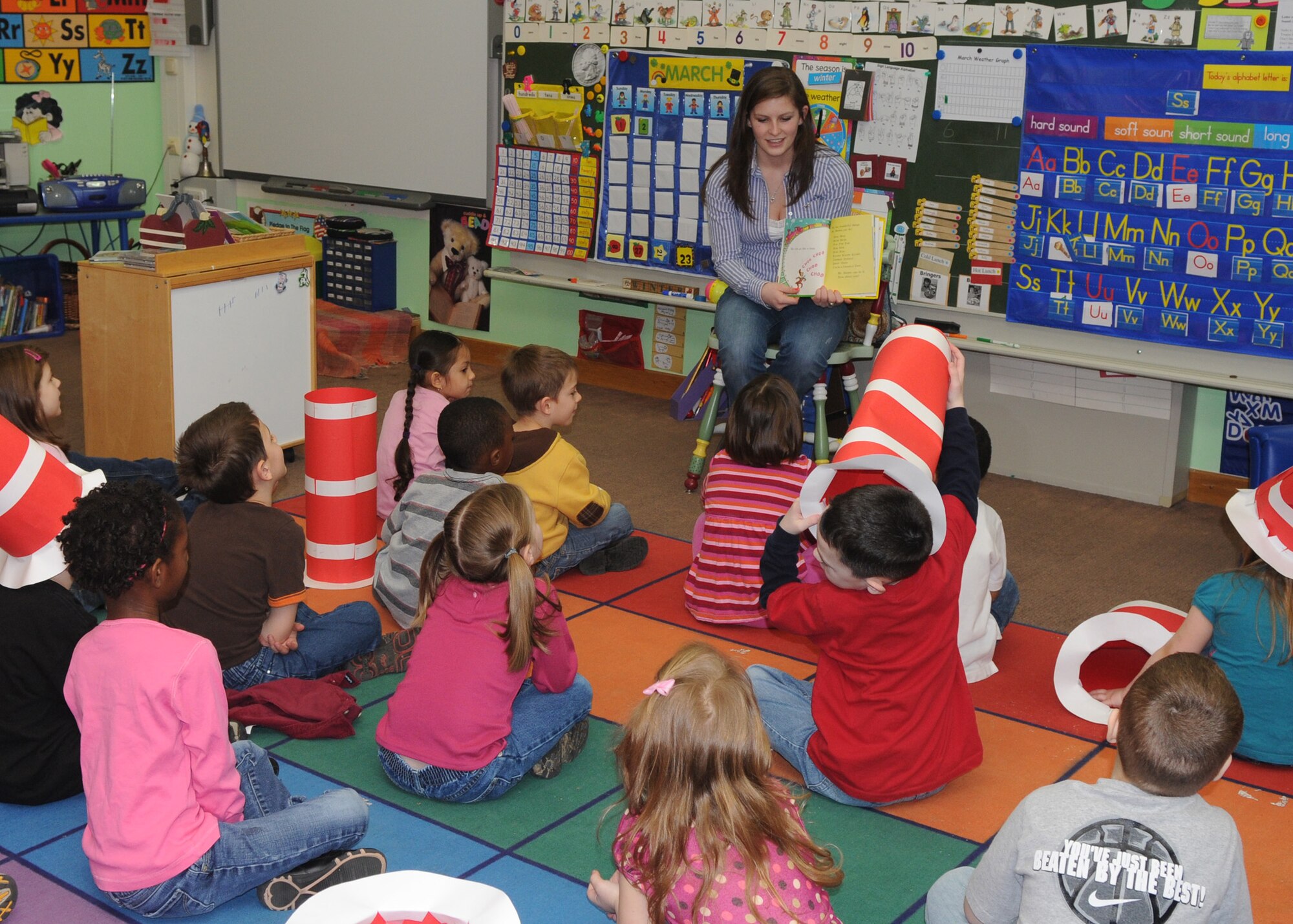 SPANGDAHLEM AIR BASE, Germany -- Kristin Boring, Bitburg High School student, reads to a class of Bitburg Elementary School students as part of Read Across America March 3, 2009. Read Across America is a nationwide reading celebration that takes place each year on or near the birthday of Dr. Seuss. Kristin is the daughter of Master Sgt. Amy Thomas, 52nd Equipment Maintenance Squadron. (U.S. Air Force photo by Airman 1st Class Staci Miller)

