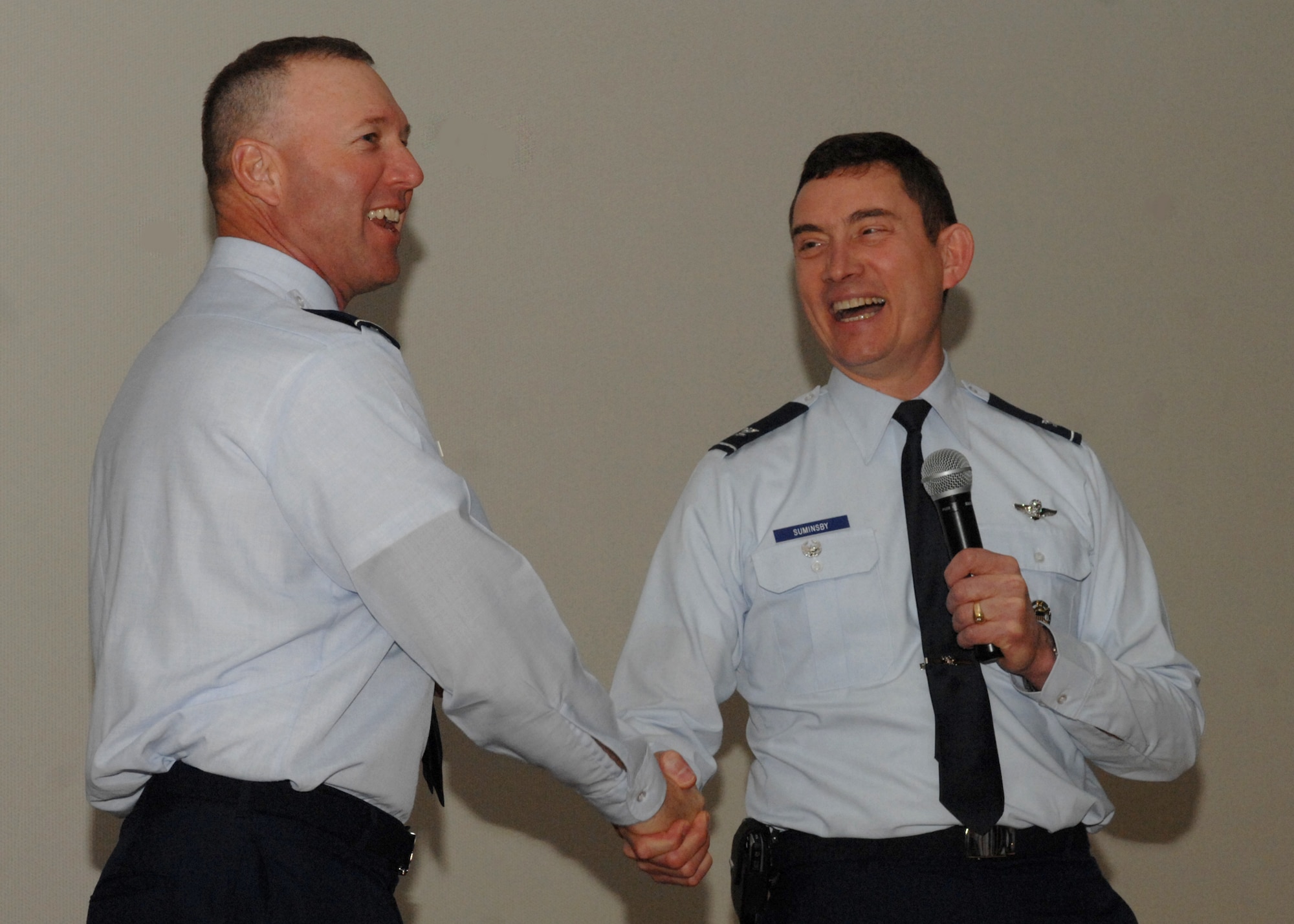 SPANGDAHLEM AIR BASE, Germany -- Col. Robert Suminsby, United States Air Forces in Europe inspector general, shakes hands with Col. Lee Wight, 52nd Fighter Wing commander, March 3, 2009.  The base had just been briefed about how it had done in phase one of the Unit Compliance Inspection. (U.S. Air Force photo by Senior Airman Jenifer H. Calhoun)