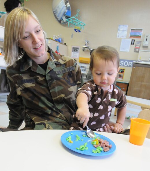 YOKOTA AIR BASE, Japan -- Staff Sgt. Melissa Pasion, 374th Dental Squadron, and daughter Kaitlyn, eat green eggs and ham March 3 at the Yume Child Development Center. Yokota's child development centers invited parents to eat breakfast with their children to celebrate Dr. Seuss' birthday as part of the National Education Association's "Read Across America" program. Dr. Seuss is the pen name of Theodore Seuss Geisel, an American writer and cartoonist who published more than 60 children's books, including the bestsellers "Green Eggs and Ham" and "The Cat in the Hat." (U.S. Air Force photo/Senior Airman Veronica Pierce)
