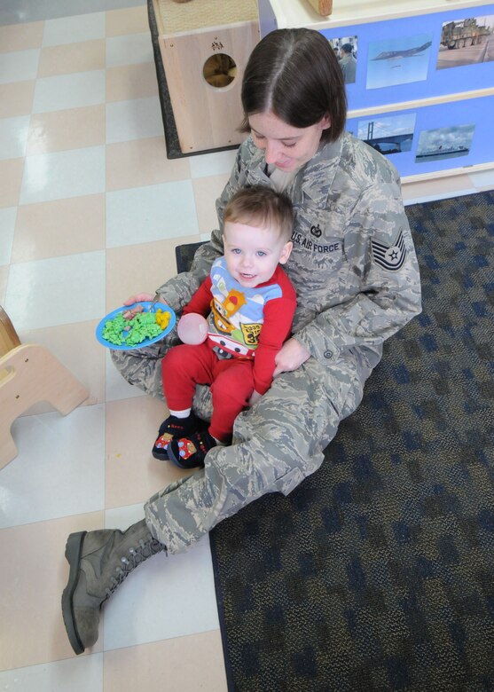 YOKOTA AIR BASE, Japan -- Tech. Sgt. Kimberly Spinner, 374th Airlift Wing public affairs, and son Ethan, eat green eggs and ham March 3 at the Yume Child Development Center. Yokota's child development centers invited parents to eat breakfast with their children to celebrate Dr. Seuss' birthday as part of the National Education Association's "Read Across America" program. Dr. Seuss is the pen name of Theodore Seuss Geisel, an American writer and cartoonist who published more than 60 children's books, including the bestsellers "Green Eggs and Ham" and "The Cat in the Hat." (U.S. Air Force photo/Senior Airman Veronica Pierce)

