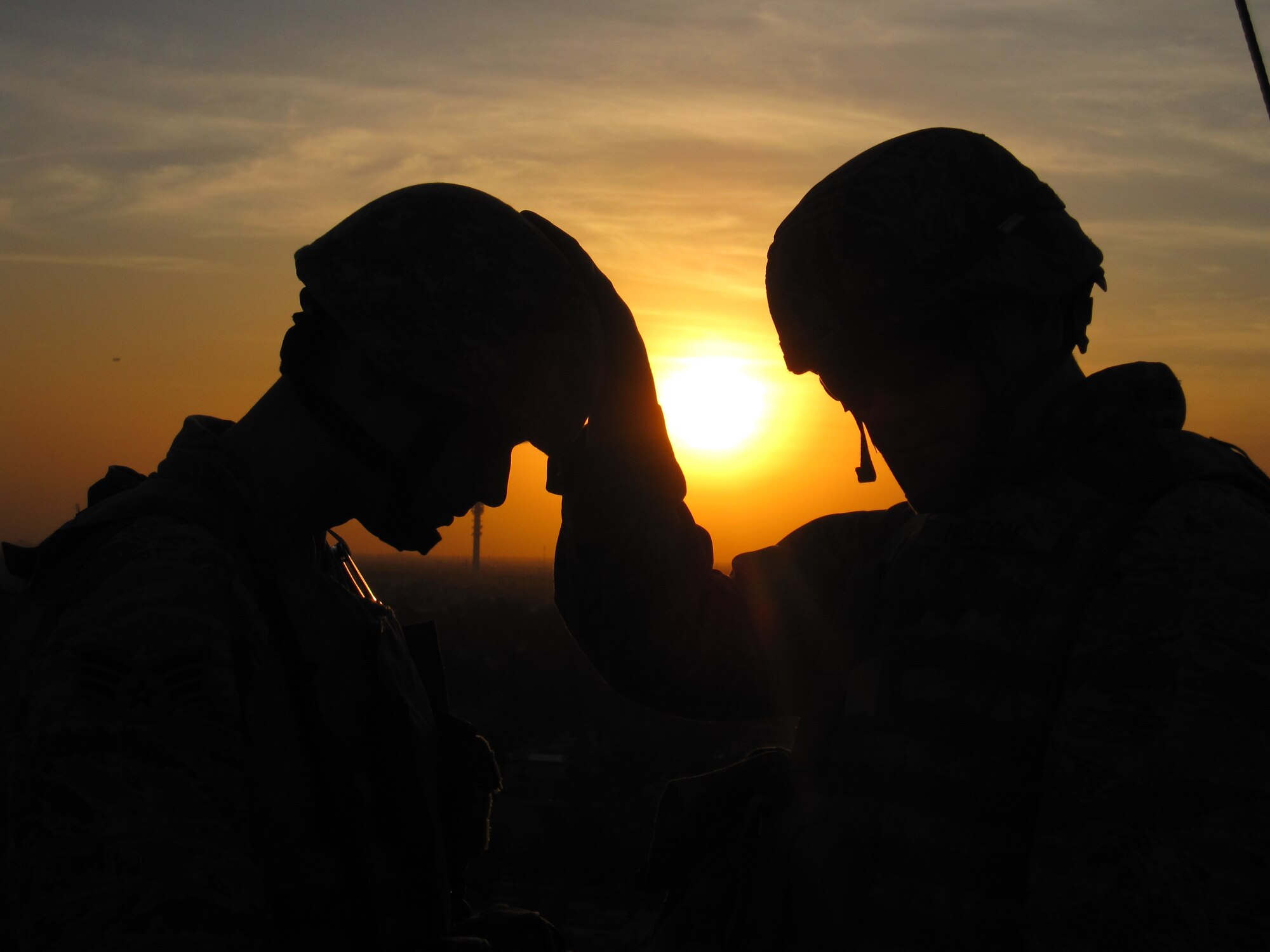 Chaplain (Capt.) David Haltom, 732nd Air Expeditionary Group, provides spiritual guidance to a Joint Expeditionary Tasked airman in a combat zone. As one of the only ‘combat’ chapel teams, Chaplain Haltom and Staff Sgt. Porscha Howard, the chapel team for the 732nd AEG, provide chapel support to Joint Expeditionary Tasked Airmen, who are filling Army positions in unique locations. (Courtesy photo)