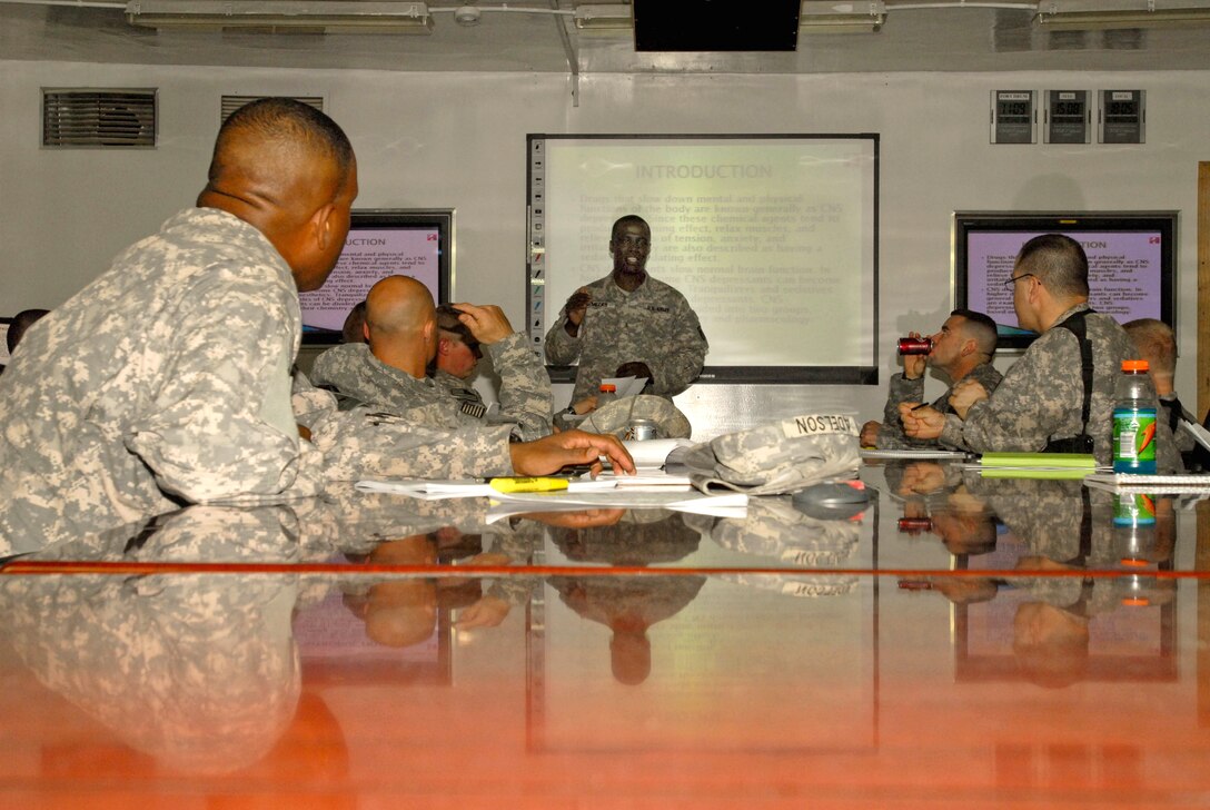 Army Chief Warrant Officer 2 Robert Meeks, 41st Fires Brigade targeting officer, teaches criminal justice and military science courses at Camp Victory, Iraq, Feb. 19, 2009. U.S. Army photo by Spc. Debralee P. Crankshaw