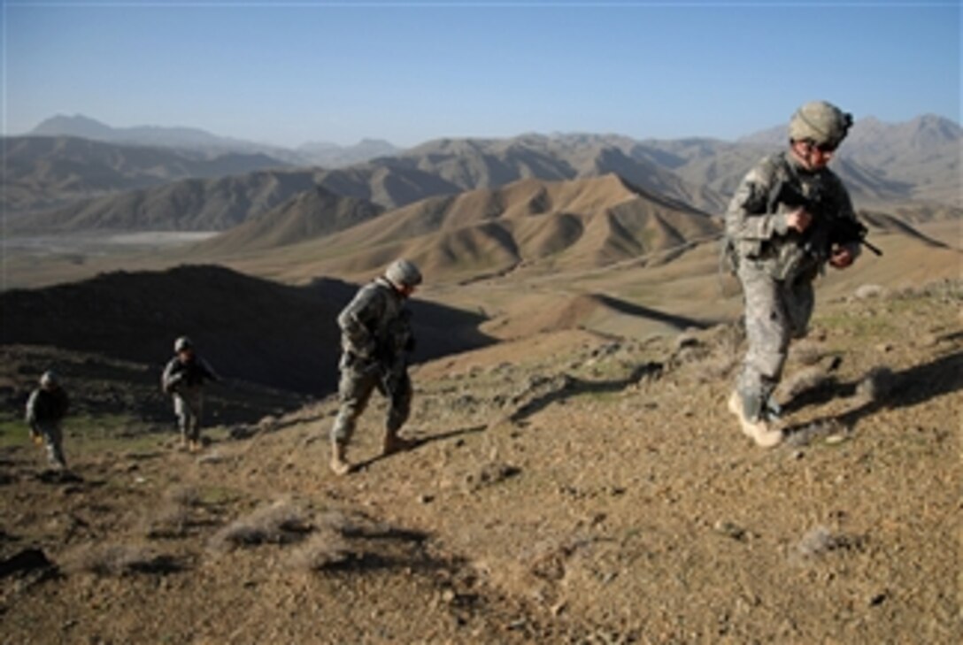 U.S. Army Sgt. Brandon Barnett (right) from Bravo Company, 1st Battalion, 4th Infantry Regiment, United States Army Europe leads his team up a ridge line during a dismounted patrol near Forward Operation Base Lane, Zabul Province, Afghanistan, on Feb. 26, 2009.  