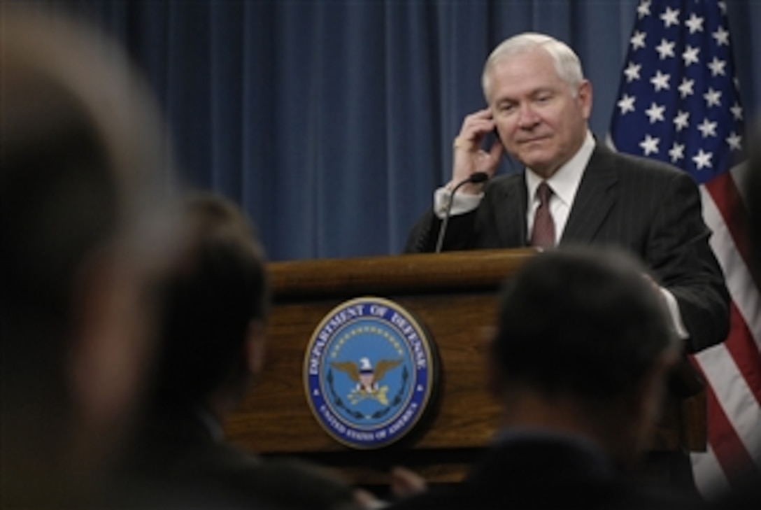 Secretary of Defense Robert M. Gates listens to a reporter’s question through a translation earpiece during a press briefing with French Minister of Defense Herve Morin in the Pentagon on March 3, 2009.  