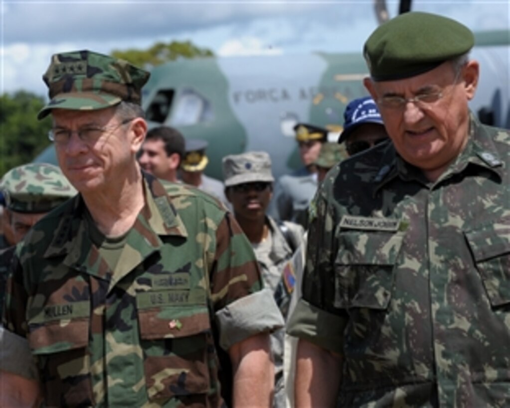 Chairman of the Joint Chiefs of Staff U.S. Navy Adm. Mike Mullen and Brazilian Minister of Defense Nelson Jobim leave the airstrip after flying in on a Brazilian C-105 aircraft to Ipiranga, Brazil, March 2, 2009. The chairman visited Brazil to meet with the minister of defense and see Brazilian operations in the Amazon region. 