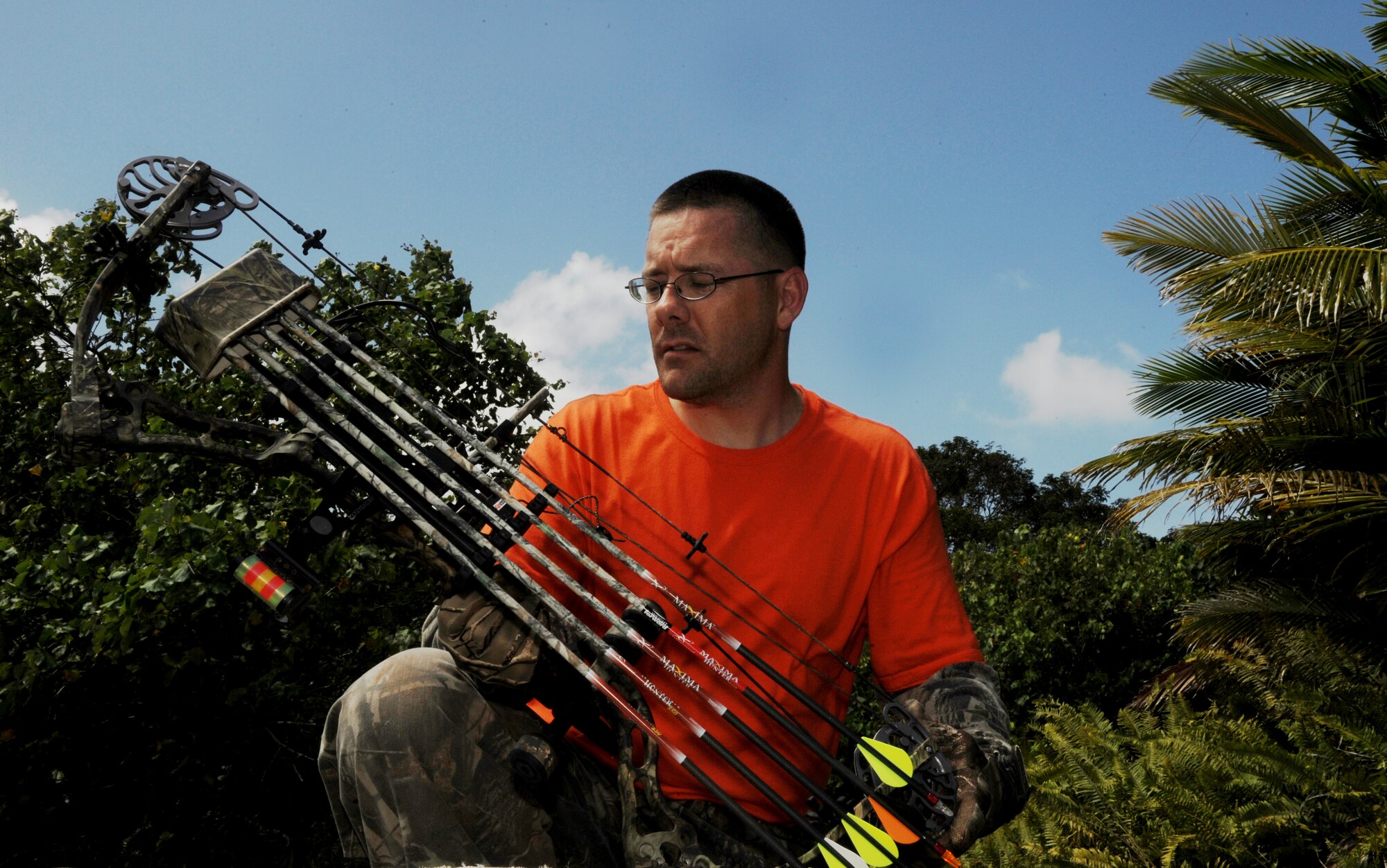 Master Sgt. Lance Kagele checks out his compound bow during a weekend hunt for wild pig and deer at Andersen Air Force Base, Guam. The base allows bow hunting for licensed hunters on certain areas of installation. Sergeant Kagele is an aircrew flight equipment superintendent assigned to the 36th Operational Support Squadron and is deployed from Elmendorf AFB, Alaska supporting U.S. theater security package.

(U.S. Air Force photo/ Master Sgt. Kevin J. Gruenwald) released
