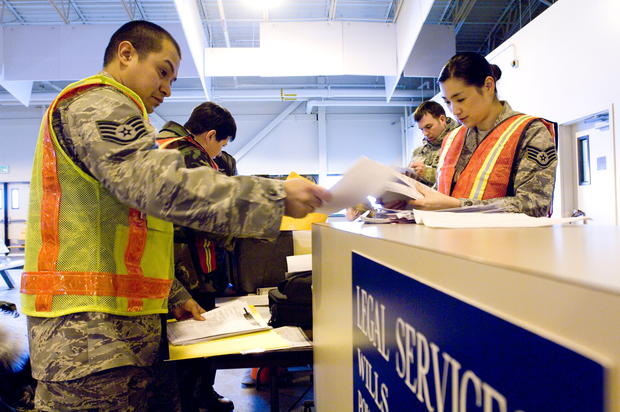 ELMENDORF AIR FORCE BASE, Alaska -- Staff Sgts. Roel Segovia and Tina Simpson, 3rd Aerospace Medical Squadron, review deployment records for a mock deployment during an exercise March 3, 2009. The 3rd Wing is exercising in preparation to operational readiness inspection. (U.S. Air Force photo by Senior Airman Jonathan Steffen)