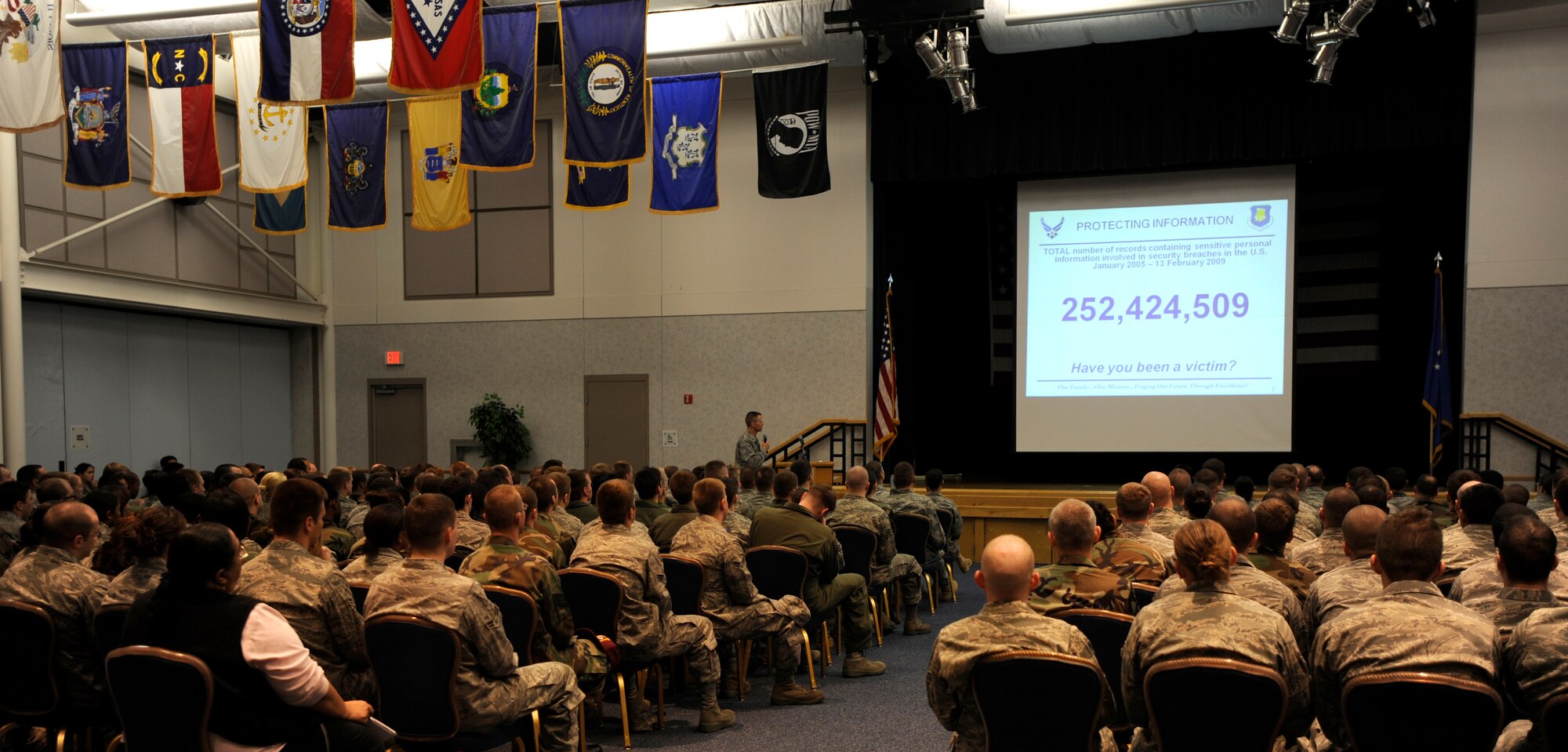 MCCONNELL AIR FORCE BASE, Kan. – Maj. Sean Robinson, 22nd Communications Squadron commander, briefs Team McConnell Airmen on cyber security at the Robert J. Dole Community Center Ballroom, Feb. 26. Between January 2005 and February 2009, more than 250 million records containing personal information have been involved in security breaches within the United States. The importance of cyber training is to keep Airmen aware of their surroundings and to make sure that no information is leaked. (Photo by Senior Airman Laura Suttles)