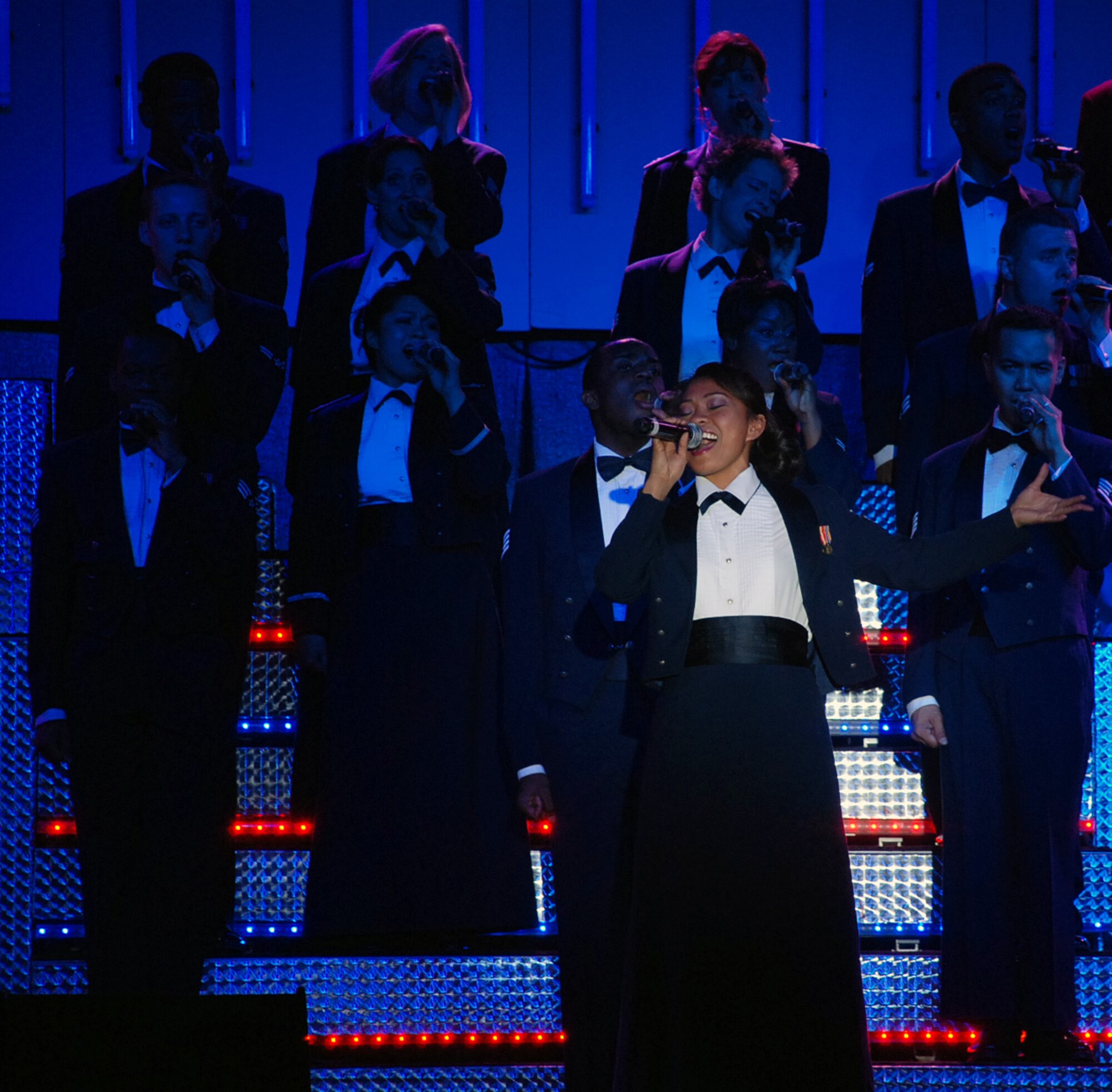 LAUGHLIN AIR FORCE BASE, Texas – Senior Airman Cristy Lagazo, Tops in Blue vocalist, performs one of the closing songs during the Tops in Blue performance inside the T-6 Weather Shelter here Feb. 25. The Air Forces leading entertainment group comprised of 37 active-duty members performed for nearly 600 Laughlin members as a part of their 10 month 2008-2009 World Tour titled “Deja Blue.”(U.S. Air Force photo by Airman 1st Class Sara Csurilla)