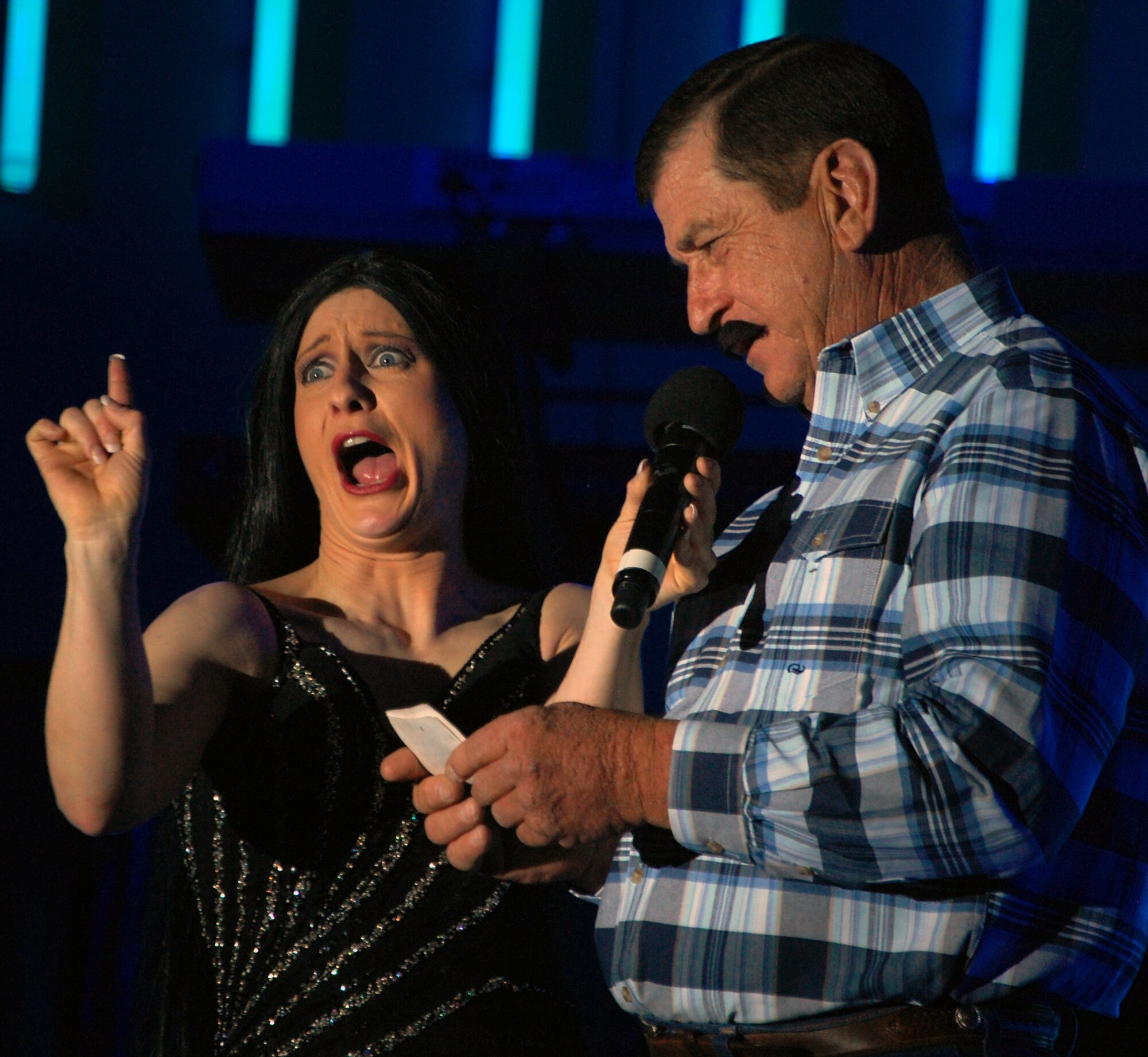 LAUGHLIN AIR FORCE BASE, Texas – Senior Airman April Vollm, Tops in Blue comedian, encouraged Charlie Cox, 47th Maintenance Directorate, to act as Sonny Bono, during the Tops in Blue performance inside the T-6 Weather Shelter here Feb. 25. The Air Forces leading entertainment group comprised of 37 active-duty members performed for nearly 600 Laughlin members as a part of their 10 month 2008-2009 World Tour titled “Deja Blue.”(U.S. Air Force photo by Tech. Sgt. Charlie Miller)
