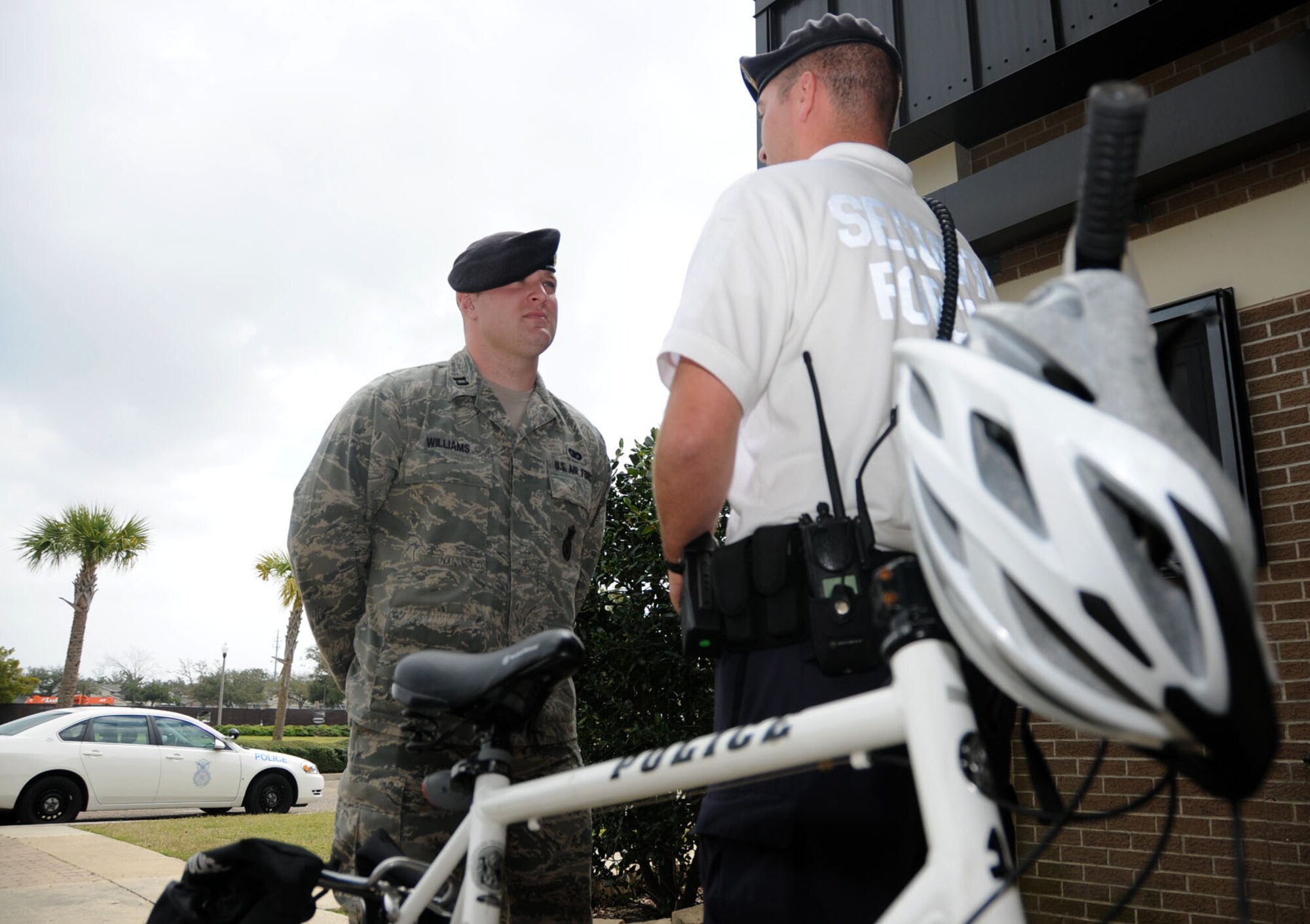Capt. Jason Williams, left, new commander of the 81st Security Forces Squadron, receives a post brief Friday from Staff Sgt. Casey Sims, who’s been on bicycle patrol with Falcon Flight.  Captain Williams, the squadron’s former operations officer, assumed command from Maj. Joseph Musacchia Feb. 18.  Major Musacchia, who’s deployed to Iraq with the Multi National Security Command, led the unit since May 2007.  (U.S. Air Force photo by Kemberly Groue)