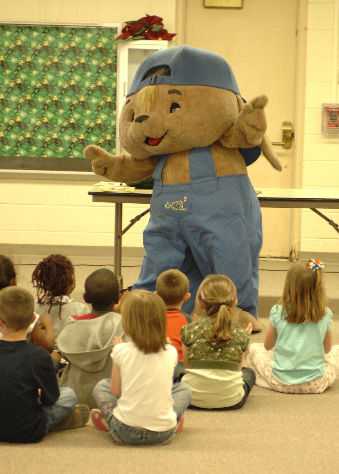 "Sammy the Rabbit", co-created by Mr. Sam Renick, children's author, educates children at the Primary School, Feb. 26, at Holloman Air Force Base, N.M., on saving money early. Mr. Renick visits numerous military installations to speak to children about getting in the habit of saving money early. (U.S. Air Force photo/Airman 1st Class Rachel A. Kocin)