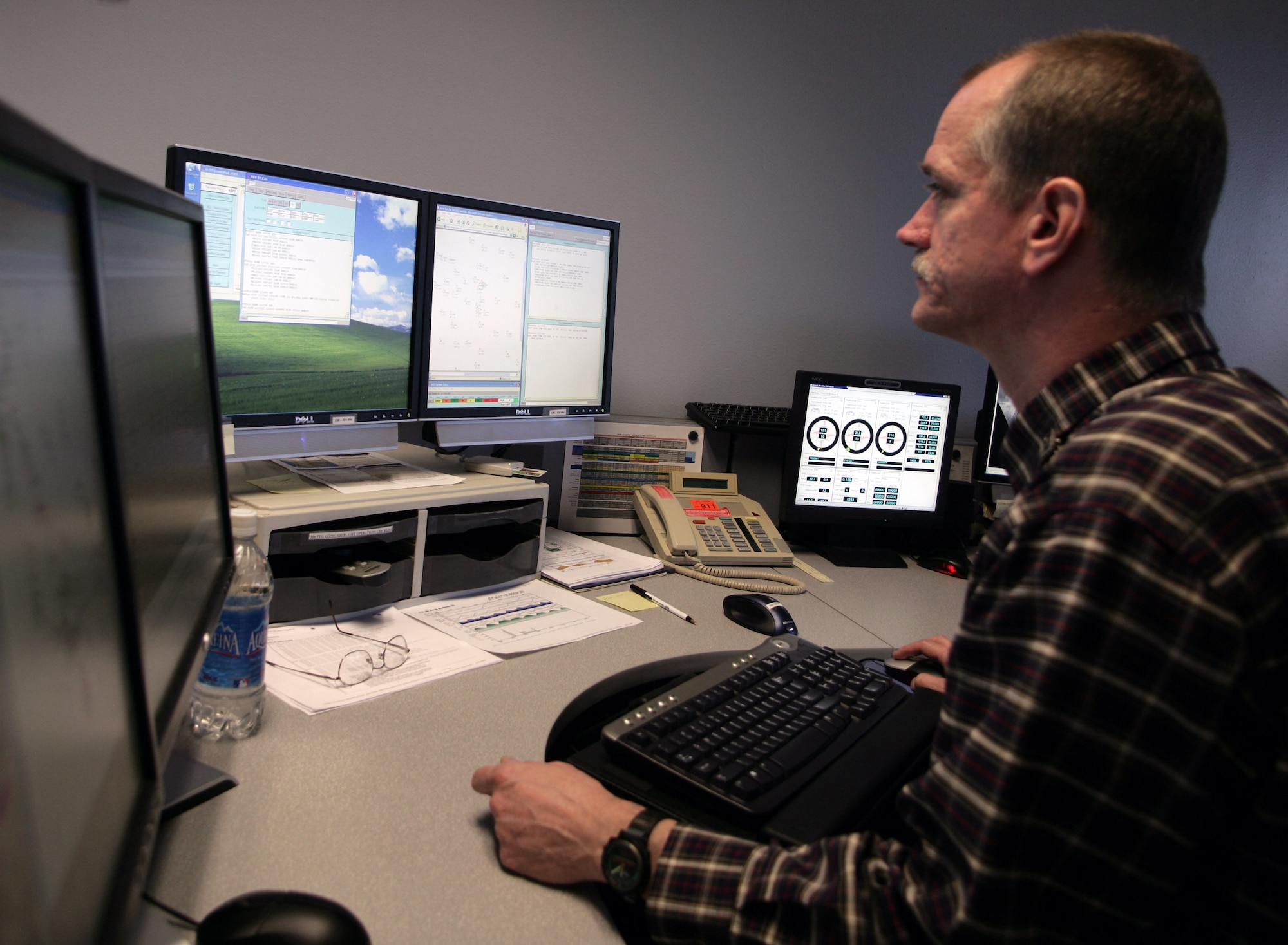 Jeff Rosbach, a forecaster with the 306th Operational Support Squadron weather flight at the U.S. Air Force Academy, prepares a mission execution forecast. (U.S. Air Force photo/Ryan Hansen)