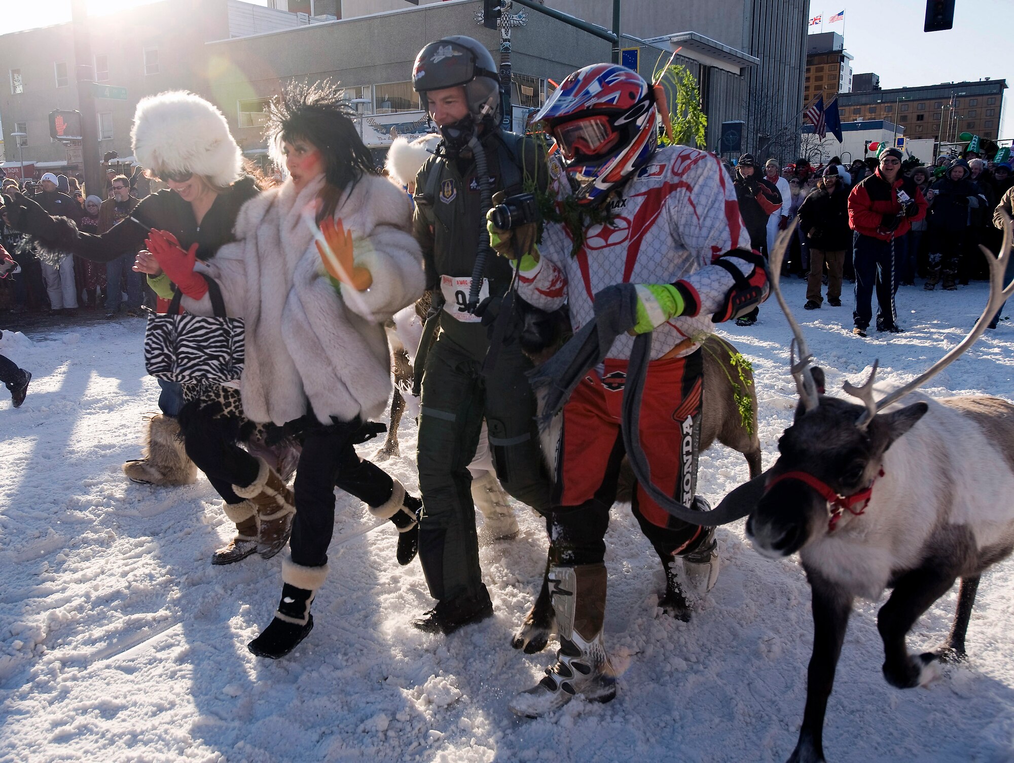 Colonel Eric Overturf and his wife, Karla Overturf, prepare to run through the streets of Anchorage during the 2nd Annual Running of the Reindeer March 1 in Alaska. Colonel and Mrs. Overturf ran in the celebrity heat running two city blocks with a herd of reindeer darting through the crowd. Colonel Overturf, an F-22 Raptor pilot, is the 477th Fighter Group commander at Elmendorf Air Force Base, Alaska. (U.S. Air Force photo/Master Sgt. Keith Brown) 