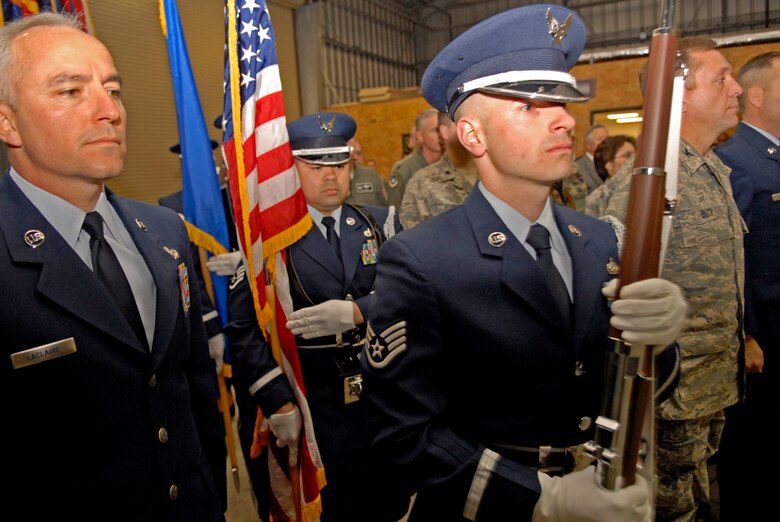 VANDENBERG AIR FORCE BASE, Calif. -- The Vandenberg Honor Guard prepares to post the colors during a Centurion Award presentation here March 3.  Seven Airmen were recipients of this prestigious award. Each Airman had to complete a total of 100 ceremonial details in support of the honor guard. This award is unique to Vandenberg; only 21 members have received the award since its inception. (U.S. Air Force photo/Senior Airman Christian Thomas)