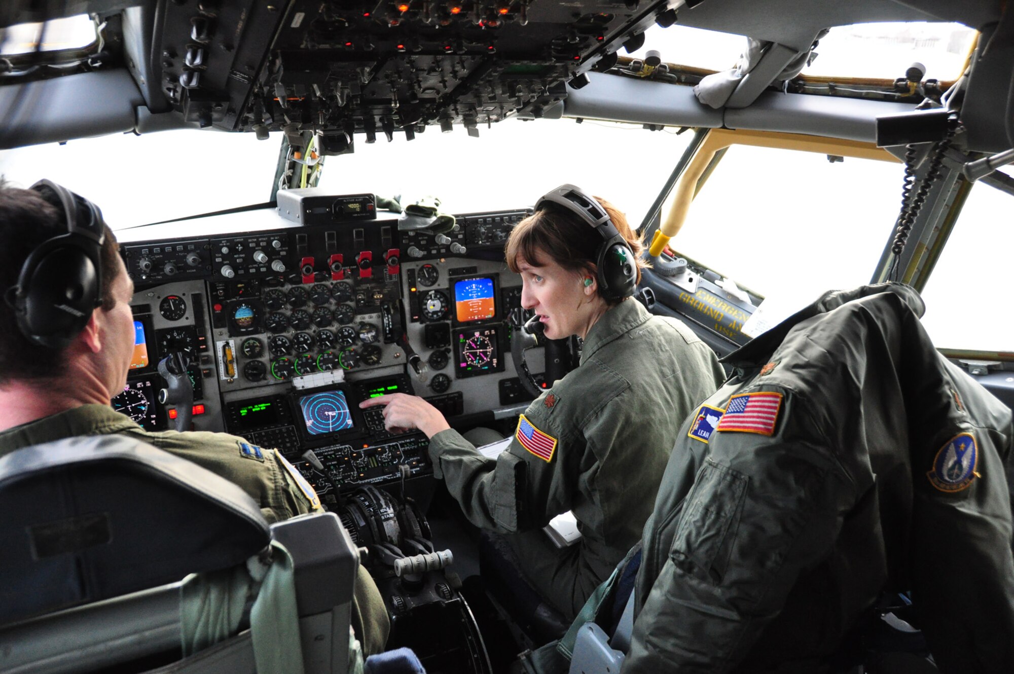 Maj. Leah Schmidt goes over preparations for a KC-135 Stratotanker mission with another pilot from the 18th Air Refueling Squadron, the flying unit of the 931st Air Refueling Group at McConnell Air Force Base, Kan. Major Schmidt, one of two female KC-135 pilots assigned to her squadron, represented the 931st at the 2009 Women in Aviation Conference in Atlanta, Ga. The conference coincided with Women's History Month in March, a time to recognize the contributions of women like Major Schmidt. (Courtesy photo/Lt. Col. Tsuyoshi Tung)