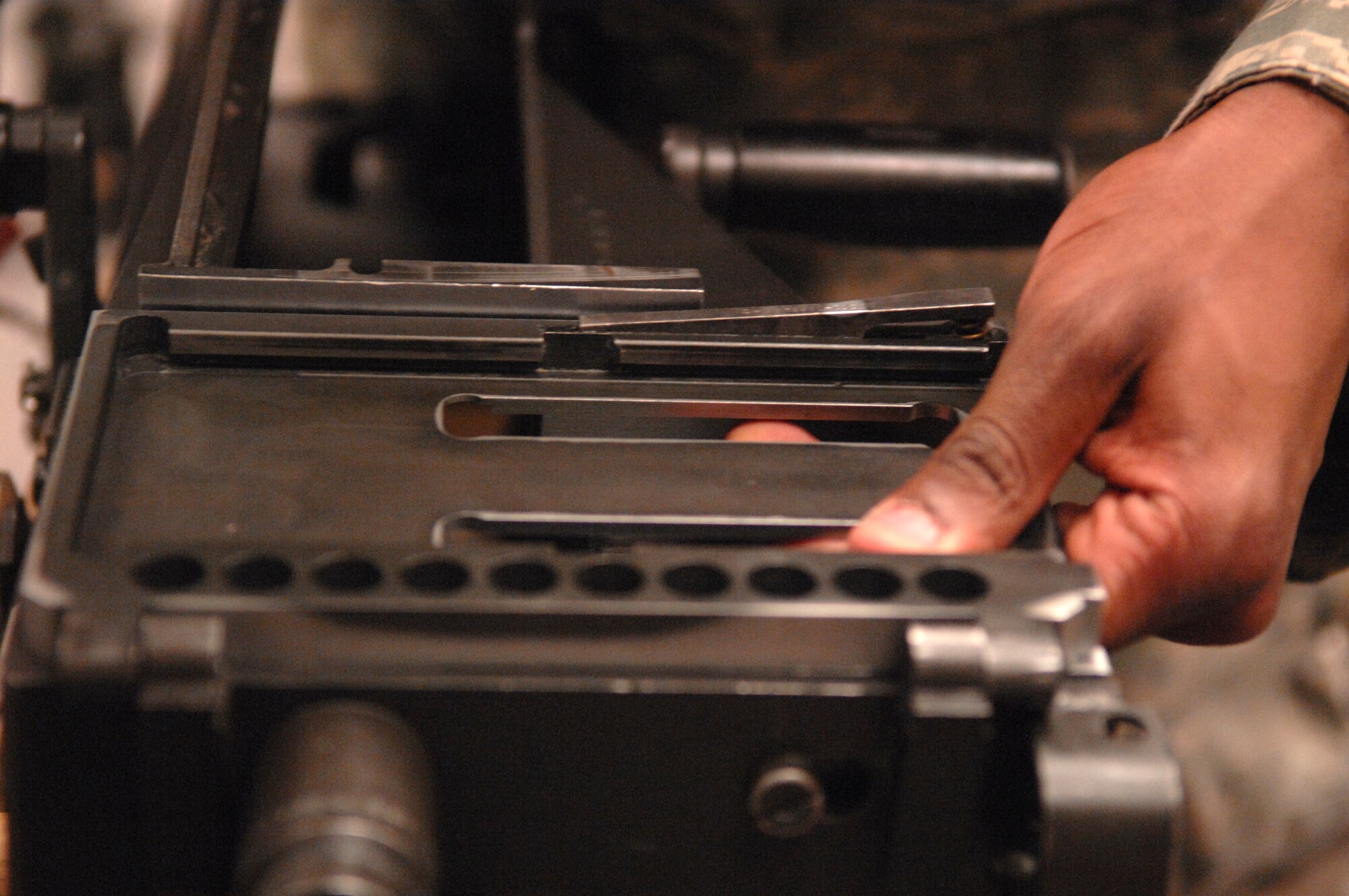 WHITEMAN AIR FORCE BASE, Mo. – Senior Airman Kashara Joseph, 509th Security Forces Squadron, assembles a MK-19 during familiarization training Feb. 27. The system was deployed in Southwest Asia during Operation Desert Storm and devastated enemy infantry. (U.S. Air Force photo/Senior Airman Stephen Linch)