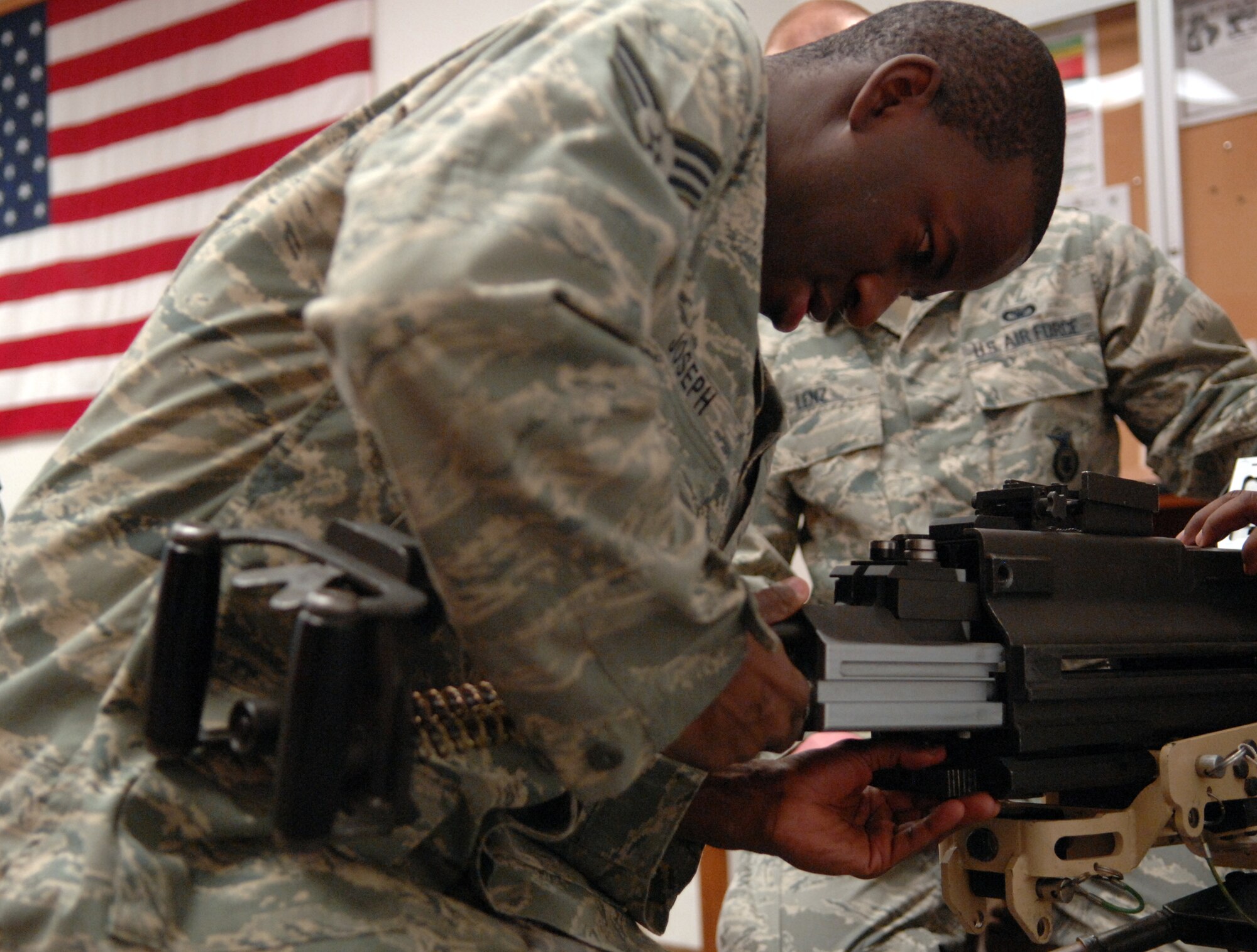 WHITEMAN AIR FORCE BASE, Mo. – Senior Airman Kashara Joseph, 509th Security Forces Squadron, assembles a MK-19 during familiarization training Feb. 27. The system was deployed in Southwest Asia during Operation Desert Storm and devastated enemy infantry. (U.S. Air Force photo/Senior Airman Stephen Linch)