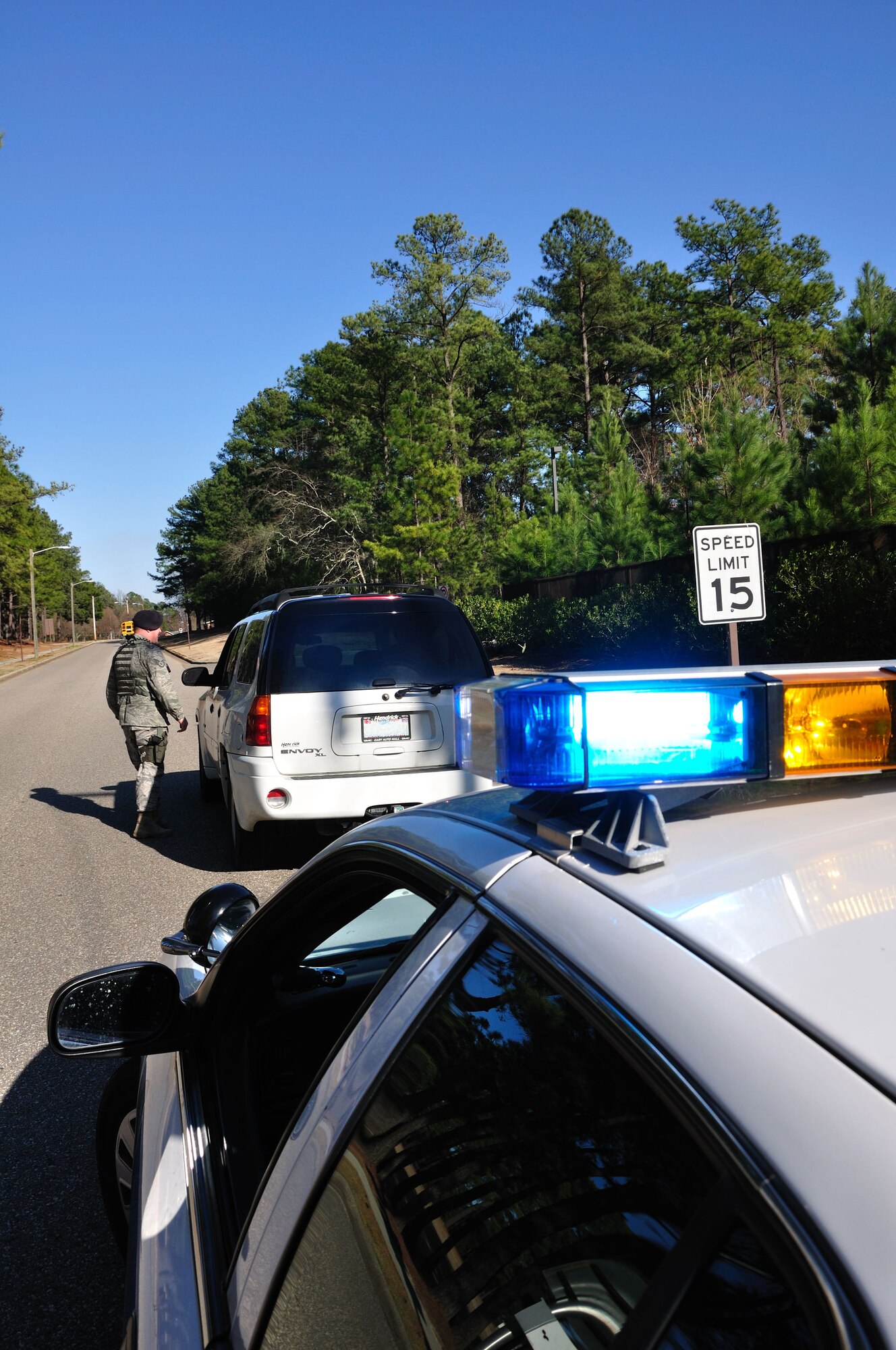 Staff Sgt. Chris Petterson, 43rd Security Forces Squadron, issues a ticket to an individual for speeding in base housing. There is a zero tolerance policy for speeding violations in the housing areas and school zones. The 43rd SFS has issued a record number of speeding tickets this year. Pope members are reminded to slow down and pay attention to traffic signs. (U.S. Air Force Photo by Tech. Sgt. Steven Kennedy)