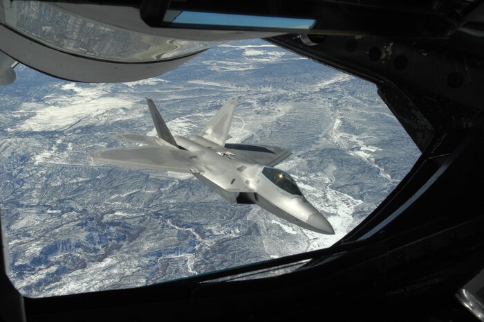 An F-22 Raptor banks away from a KC-135 Statotanker assigned to Rickenbacker Air National Guard Base Columbus, Ohio, during a refueling operation as part of a Joint RED FLAG exercise at Nellis AFB, Nev, Feb. 24.  RED FLAG is a multi-national exercise providing a realistic environment to practice combat scenarios. The experience gained during the exercises is valuable to the survival and success of air crews in combat.(U.S Air Force photo by Staff Sgt. Taylor Worley)