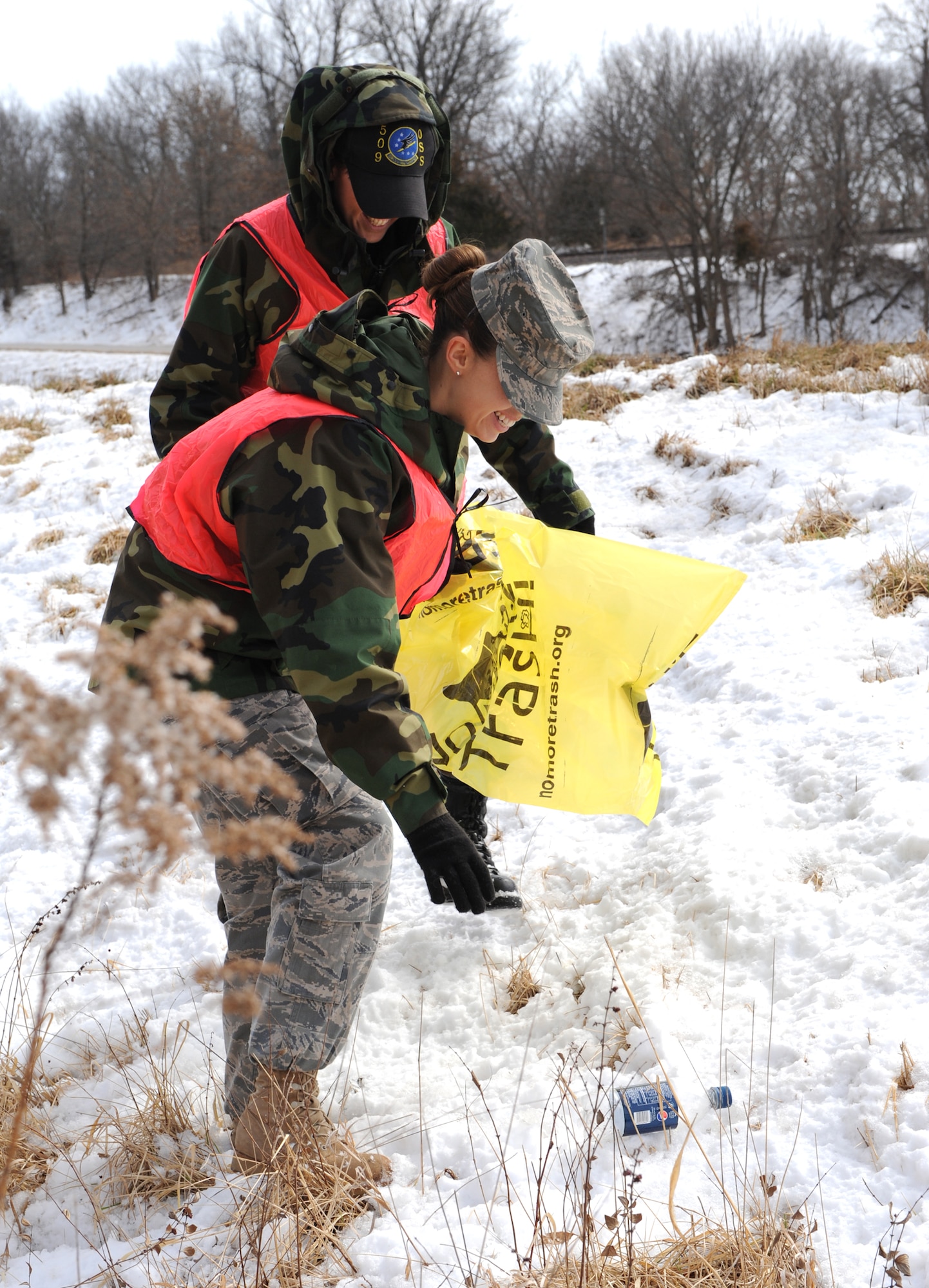 WHITEMAN AIR FORCE BASE, Mo – Senior Airmen Michelle Salyer and Bailey Lammers, 509th Operations Support Squadron clean Missouri Highway 50 in participation with the Adopt -A -Highway program March 3. The purpose of the Adopt-A-Highway program is to provide community support for litter prevention and highway beautification efforts. Missouri Department of Transportation started the Adopt-A-Highway program in the fall of 1987. The program allows the public to become personally involved in improving and helping to keep Missouri's roadsides beautiful. (U.S. Air Force photo/Airman 1st Class Carlin Leslie) 