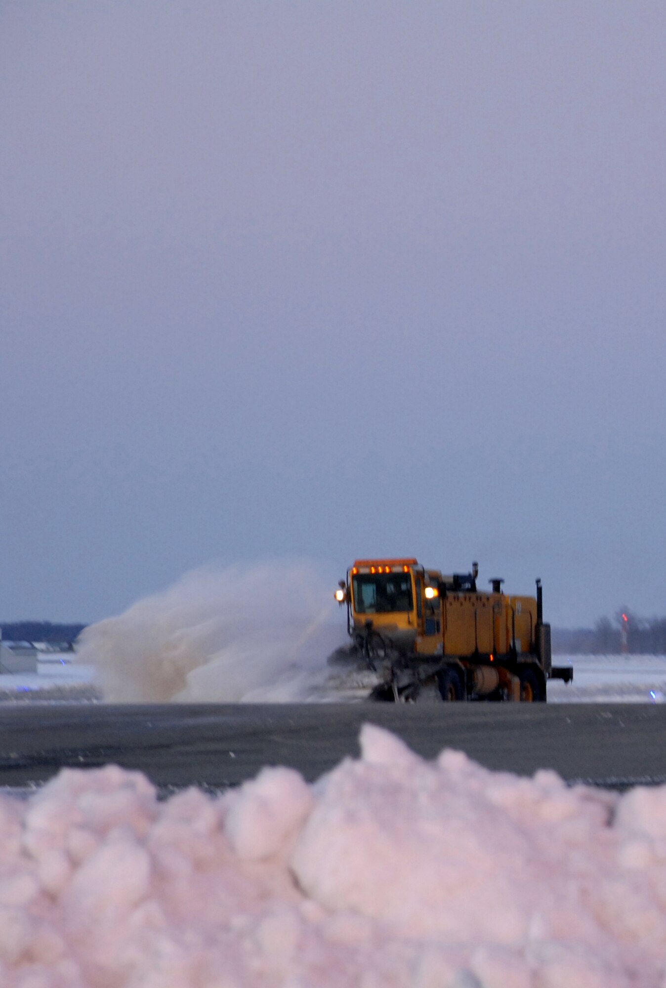 A 436th Civil Engineer Squadron snow plow works to clear the Dover Air Force Base flight line March 3. According to the 436th Operations Support Squadron Weather Flight, from the time the snow started falling at about 4:00 p.m. March 1, until it stopped at about 3:00 p.m. March 2, a total of 10.3 inches of snow fell. (U.S. Air Force Photo/2nd Lt. Brian Maguire)