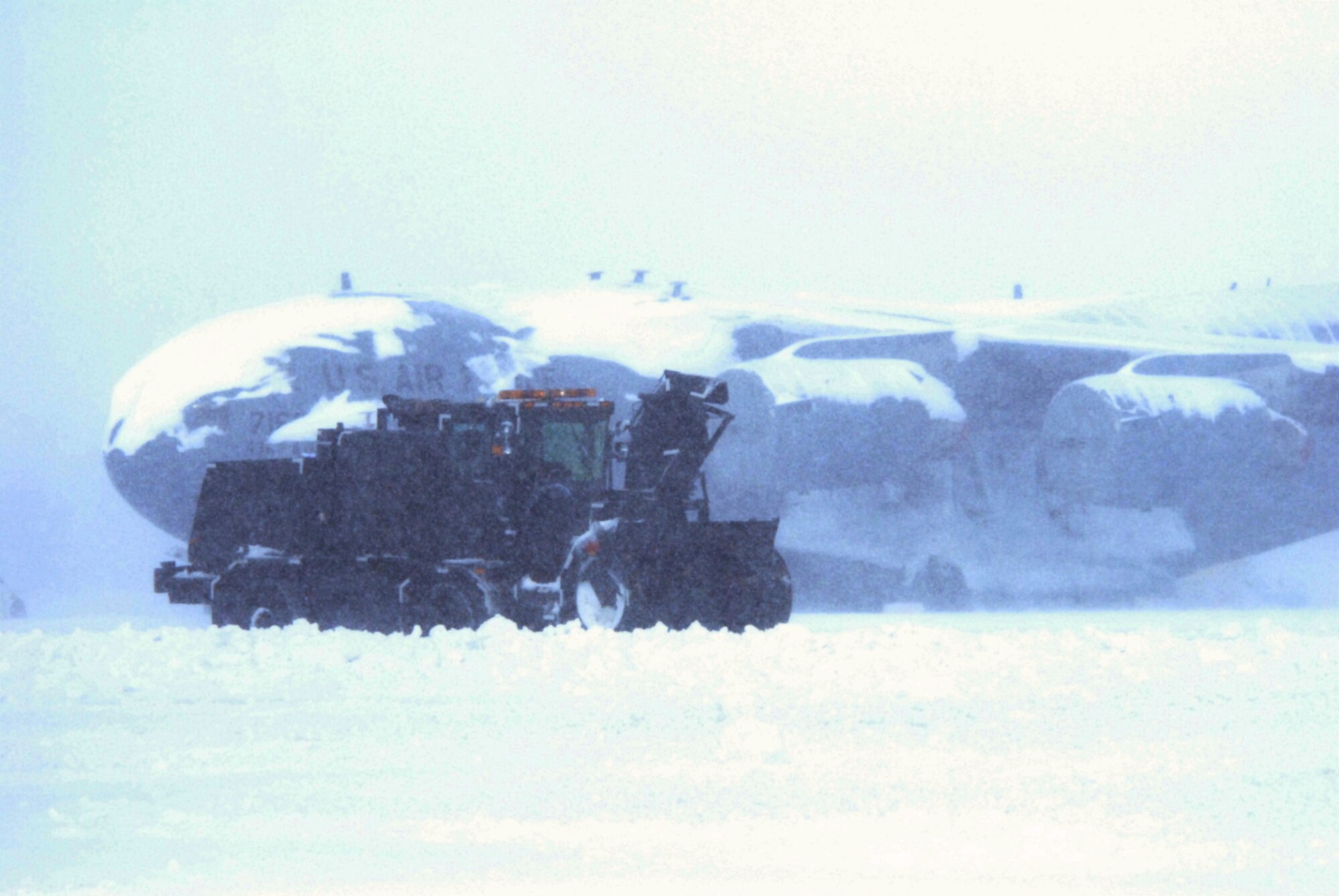 Snow removal crews work to clear the Dover Air Force Base flight line March 2. According to the 436th Operations Support Squadron Weather Flight, from the time the snow started falling at about 4:00 p.m. March 1, until it stopped at about 3:00 p.m. March 2, a total of 10.3 inches of snow fell. (U.S. Air Force Photo/2nd Lt. Brian Maguire)