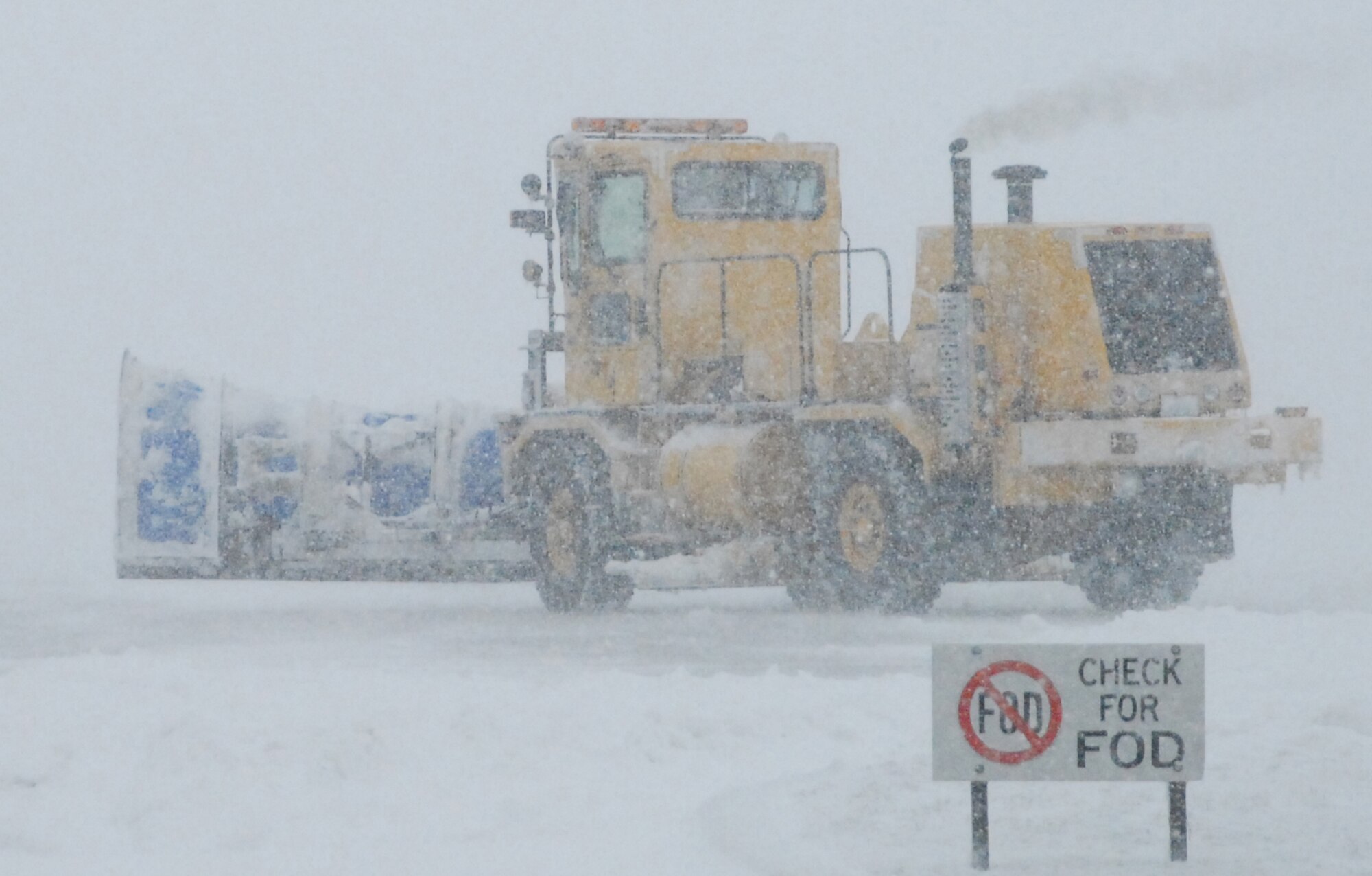 A 436th Civil Engineer Squadron snow plow works to clear the Dover Air Force Base flight line during the nor'easter March 2. According to the 436th Operations Support Squadron Weather Flight, from the time the snow started falling at about 4:00 p.m. March 1, until it stopped at about 3:00 p.m. March 2, a total of 10.3 inches of snow fell. (U.S. Air Force Photo/2nd Lt. Brian Maguire)