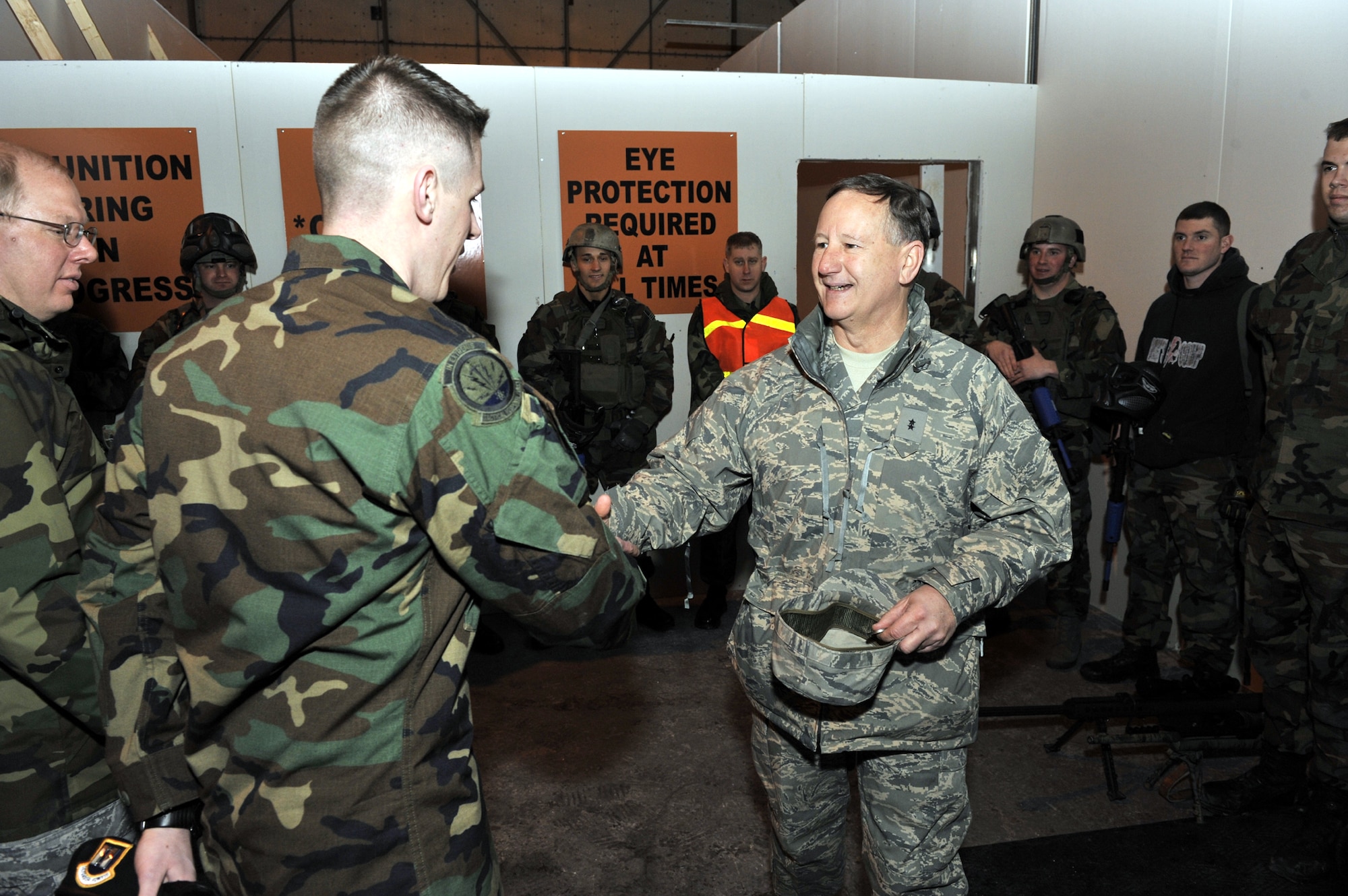 Maj. Gen. Frederick Roggero, meets Capt. Jared Hoover, 341st Security Forces Group Tactical Response Force commander, during a visit to Malmstrom Feb. 26. The TRF team put on a demonstration at their "shoot house" for the visiting Air Force Chief of Safety. (U.S. Air Force photo/John Turner)