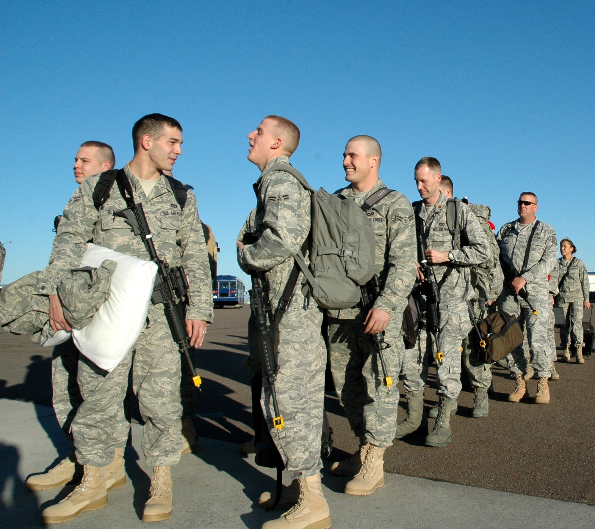 More than 230 Airmen from the 819th RED HORSE Squadron, 341st Missile Wing and 219th RHS board a commercial aircraft heading to Fort McCoy, Wis., for combat skills training prior to a  a six-month deployment to southwest Asia in support of the Global War on Terrorism. (U.S. Air Force photo/Senior Airman Dillon White)