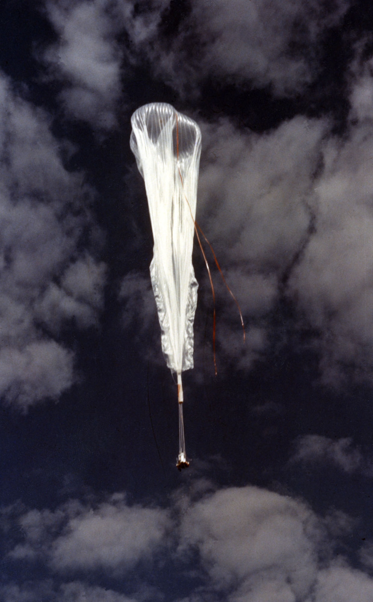 The balloon and gondola carrying Maj. Simons photographed just seconds after its launch. As the balloon climbed, the outside air pressure decreased, and the gas within the balloon expanded to fill the envelope. (U.S. Air Force photo)