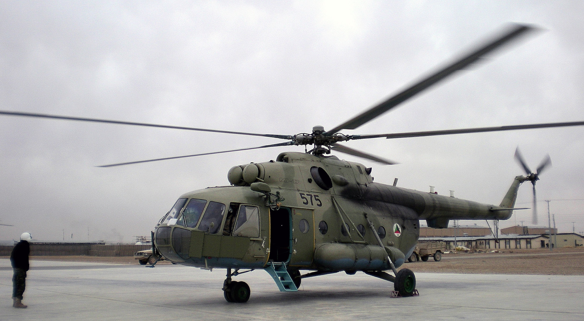 An MI-17 transport helicopter operates from Kandahar Air Base, Afghanistan. Tech. Sgts. Dennis Flanagan and Brian Roberts are mentoring Afghan air corps maintainers on the Russian-made helicopter. Both Airmen are assigned to the 718th Aircraft Maintenance Squadron from Kadena Air Base, Japan. (Courtesy photo) 
