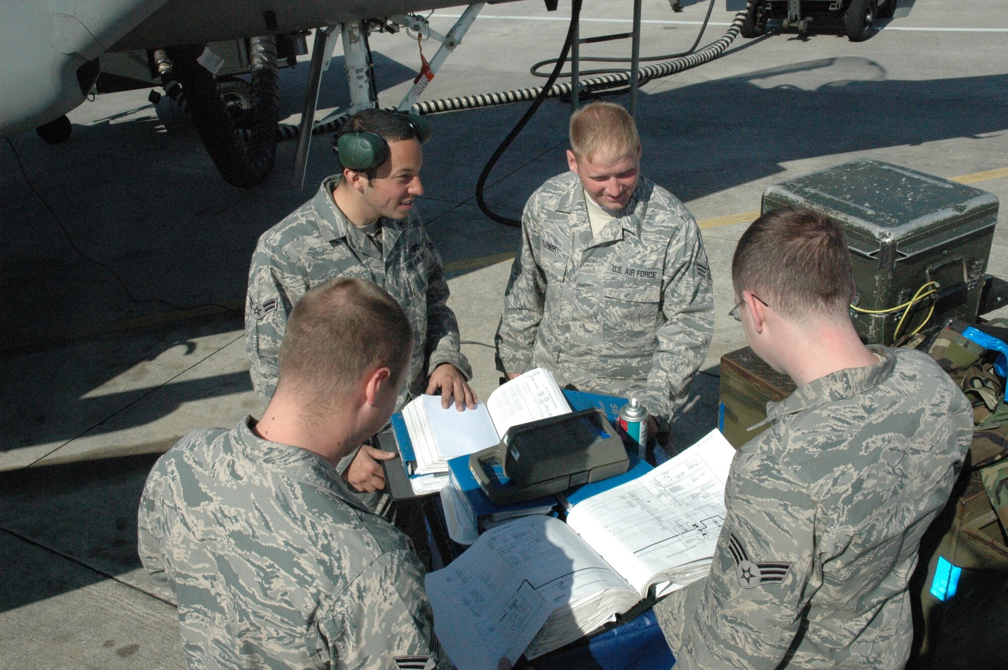 TYNDALL AIR FORCE BASE, Fla. -- Weapons specialists from the 58th Aircraft Maintenance Squadron troubleshoot a gun system malfunction during a Weapons Evaluation Program at Tyndall AFB, Fla, Feb. 25. (U.S. Air Force photo/Airman First Class Veronica McMahon)