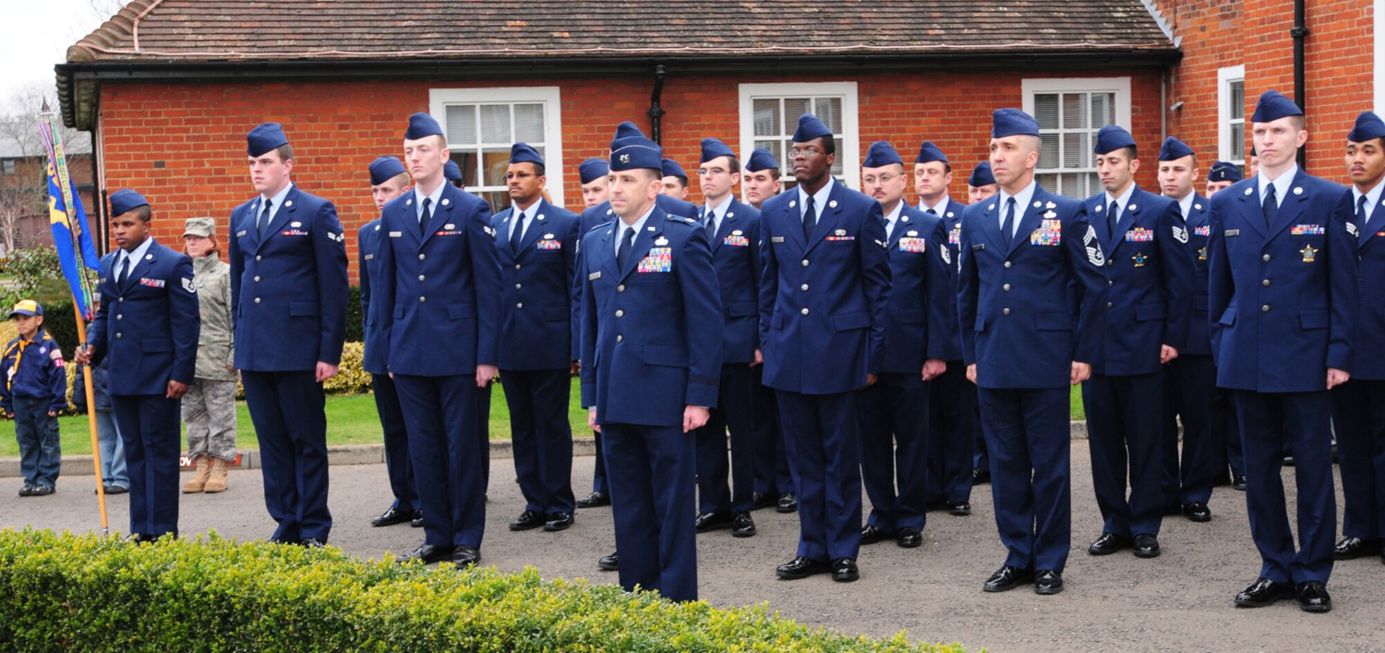 Capt. John Martin, 100th Communications Squadron Operations Flight commander, leads the flight during a retreat ceremony Feb. 27, 2009. The 100th CS took charge of the retreat as part of the Team 5/6-sponsored event, where a different squadron takes part in the retreat each month during the playing of the national anthems. (U.S. Air Force photo by Karen Abeyasekere)