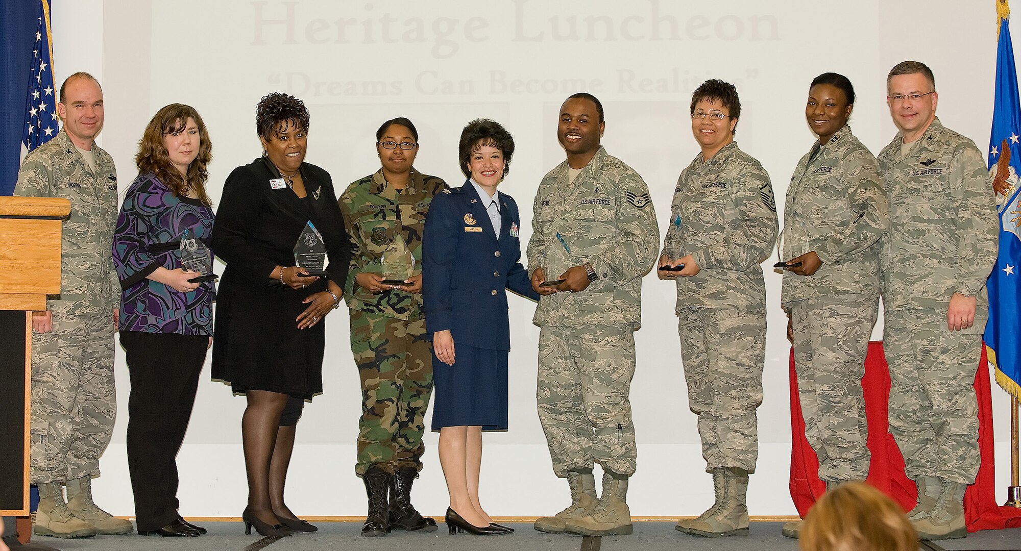 (Left to right) Col. Manson Morris, 436th Airlift Wing commander, Tech. Sgt. Angela Davis, 512th AW, Patricia Edwards, 436th Force Support Squadron, Airman 1st Class Ashley Fowler, 436th AW, Col. Donna Verchio, Senior Legal Advisor to the Air Force Inspector General, Staff Sgt. Dari Moore, 436th Aerospace Medicine Squadron, Master Sgt. Terrie Chesney, 436th FSS, Capt. Redahlia Person, 436th Aircraft Maintenance Squadron, and Col. Randal Bright, 512th AW commander. The commanders and Colonel Verchio presented the Airmen with the 2009 Major General Archer Durham Award during the African American Heritage Luncheon at The Landings Club Feb. 27. (U.S. Air Force photo/ Airman 1st Class Shen-Chia Chu)