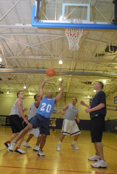 Dee Hicks, 436th Medical Group, steals the ball from 436th Force Support Squadron Airmen during a basketball game Feb. 24 at the Fitness Center. (U.S. Air Force photo/ Airman 1st Class Shen-Chia Chu)