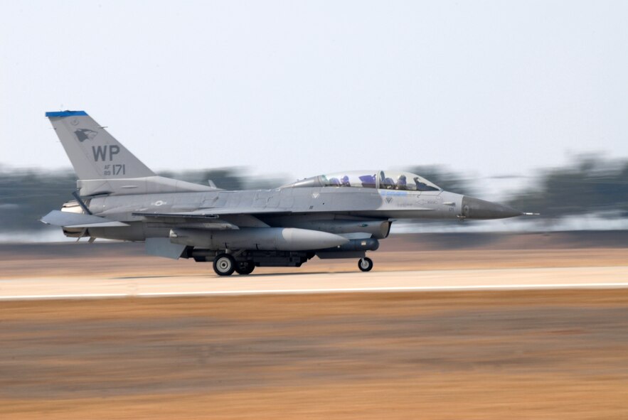Kim Myung Jung, Gunsan City's Korean National Police Chief, takes a high-speed taxi run in an F-16D Fighting Falcon piloted by Col. J.D. "Wolf" Harris, 8th Fighter Wing commander. Mr. Kim visited Kunsan Air Base, Republic of Korea as as a guest of the Pilot for a Day Program. (U.S. Air Force Photo by SSgt Jason Colbert)