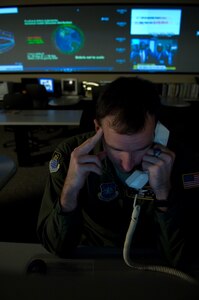 VANDENBERG AIR FORCE BASE, Calif. -- Staff Sgt. Brian Cross, a Missile Warning Sensor Controller from 614th Air and Space Operations Center, receives a phone call with information regarding the Delta II site here Mar. 4. The purpose of Joint Space Operations Center is to provide a focal point for the operational employment of worldwide joint space forces, and enable the commander of Joint Functional Component Command Space to integrate space power into global military operations.