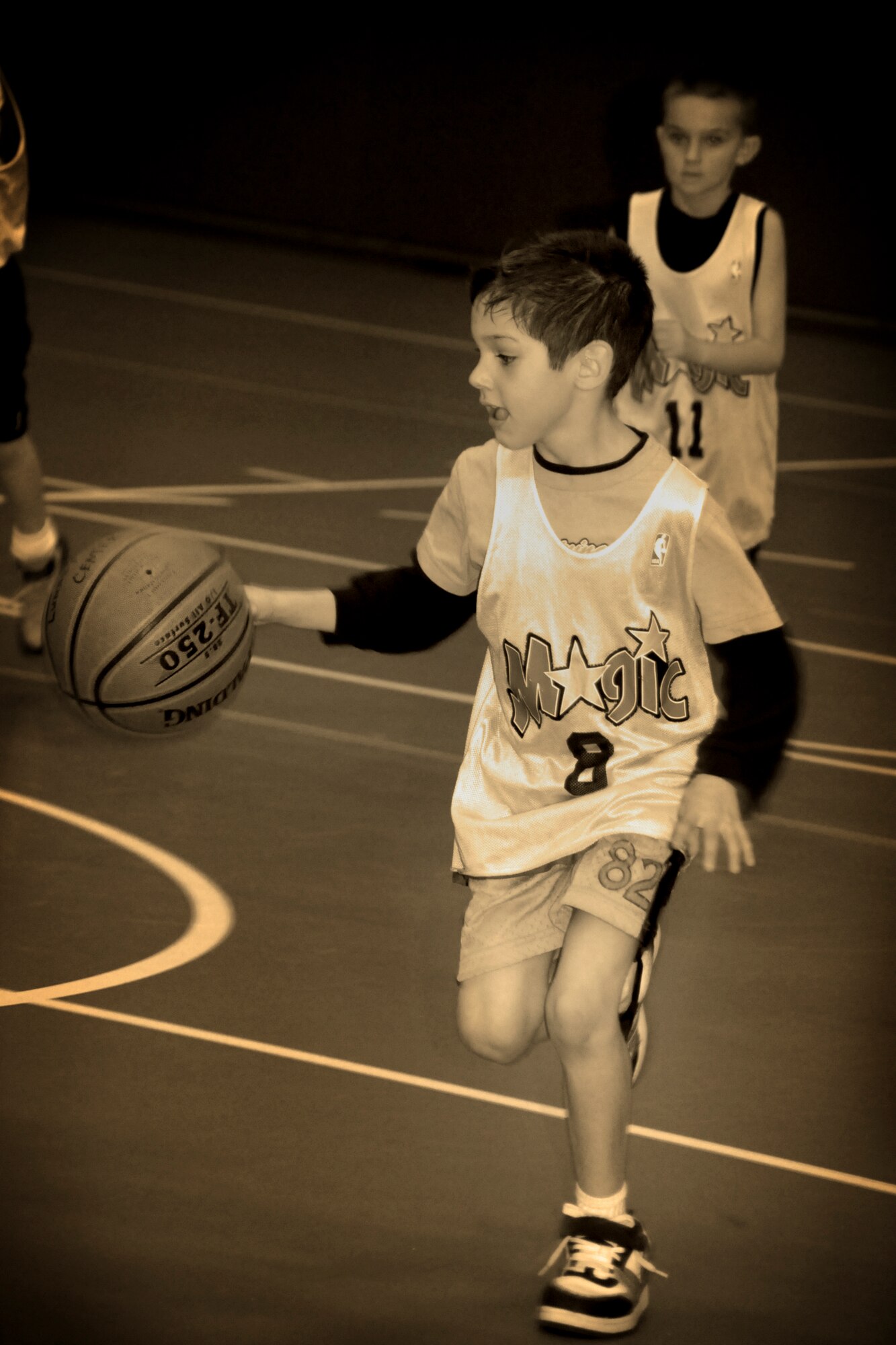 MISAWA AIR BASE, Japan -- Tyler Beverly, son of Master Sgt. Phillip Beverly and Tech. Sgt. Colleen Beverly, charges up-court during a basketball game Feb. 3, 2009. (U.S. Air Force photo by Senior Airman Jamal D. Sutter)