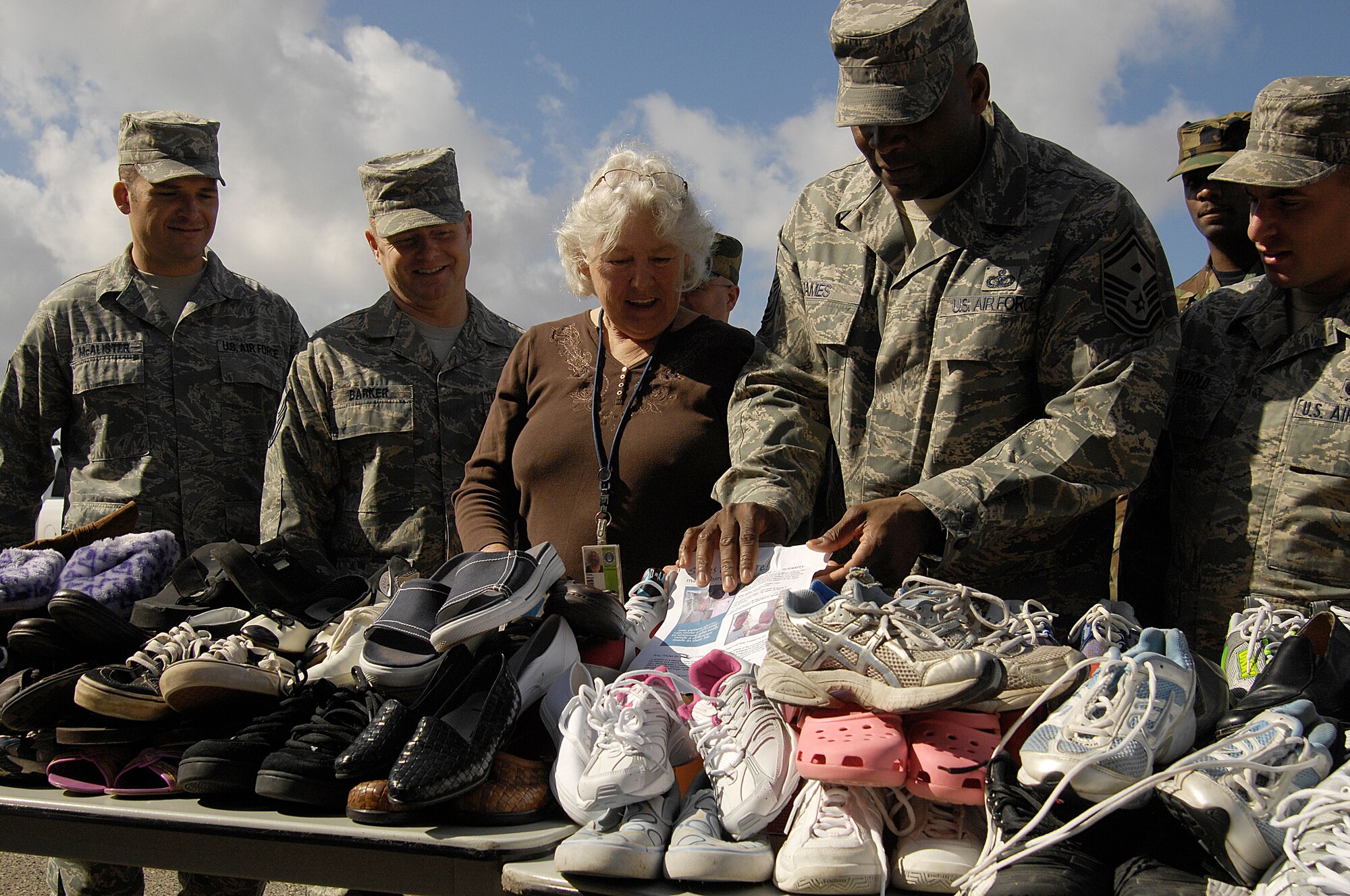 VANDENBERG AIR FORCE BASE, Calif. -- Ms. Margaret Viers, a 30th Civil Engineer Squadron environmental flight contractor, Vandenberg’s first sergeants and volunteer Airmen from the 30th Space Wing,  gather to package shoe donations from the local community in support of the Shoes to Share program here March 3. The program will donate the shoes to villagers and students of the Hwange region of Zimbabwe. (U.S. Air Force photo/Senior Airman Matthew Plew)