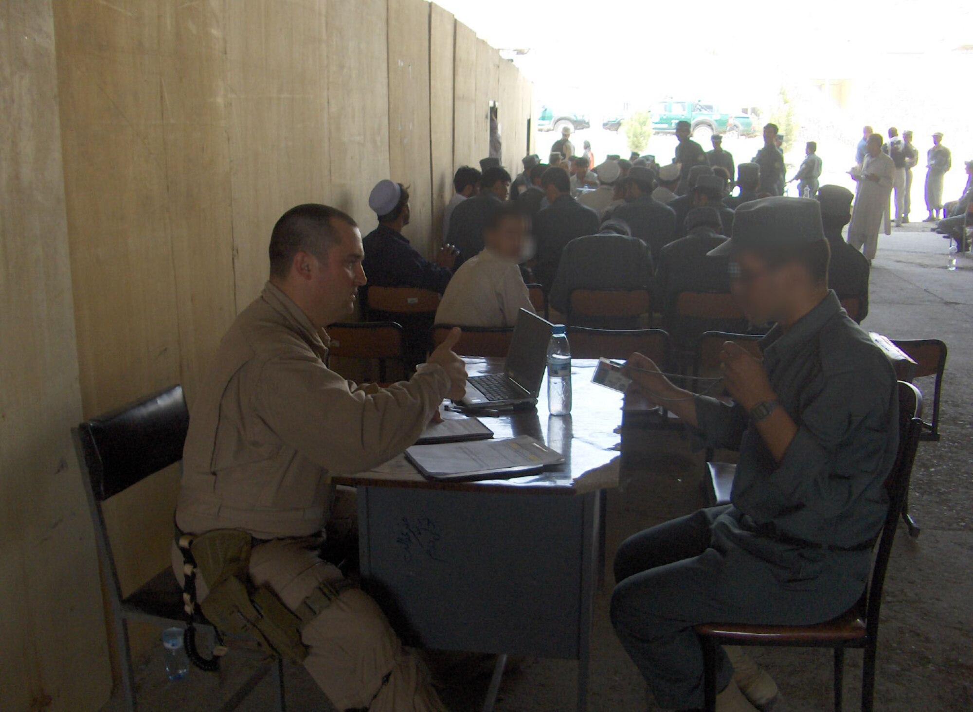 Capt. Matt Laubacher inprocesses an Afghan soldier. (Photo provided)