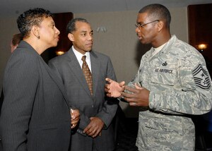 Chief Master Sgt James Davis, 316th Wing command chief, talks to Clarence Mitchell, MetLife financial services representative, and his wife Toya during the Andrews Summit 4 March. The Summit allows community members to converse with base leadership on different topics. (U.S. Air Force photo/Staff Sgt.Melissa Stonecipher)
