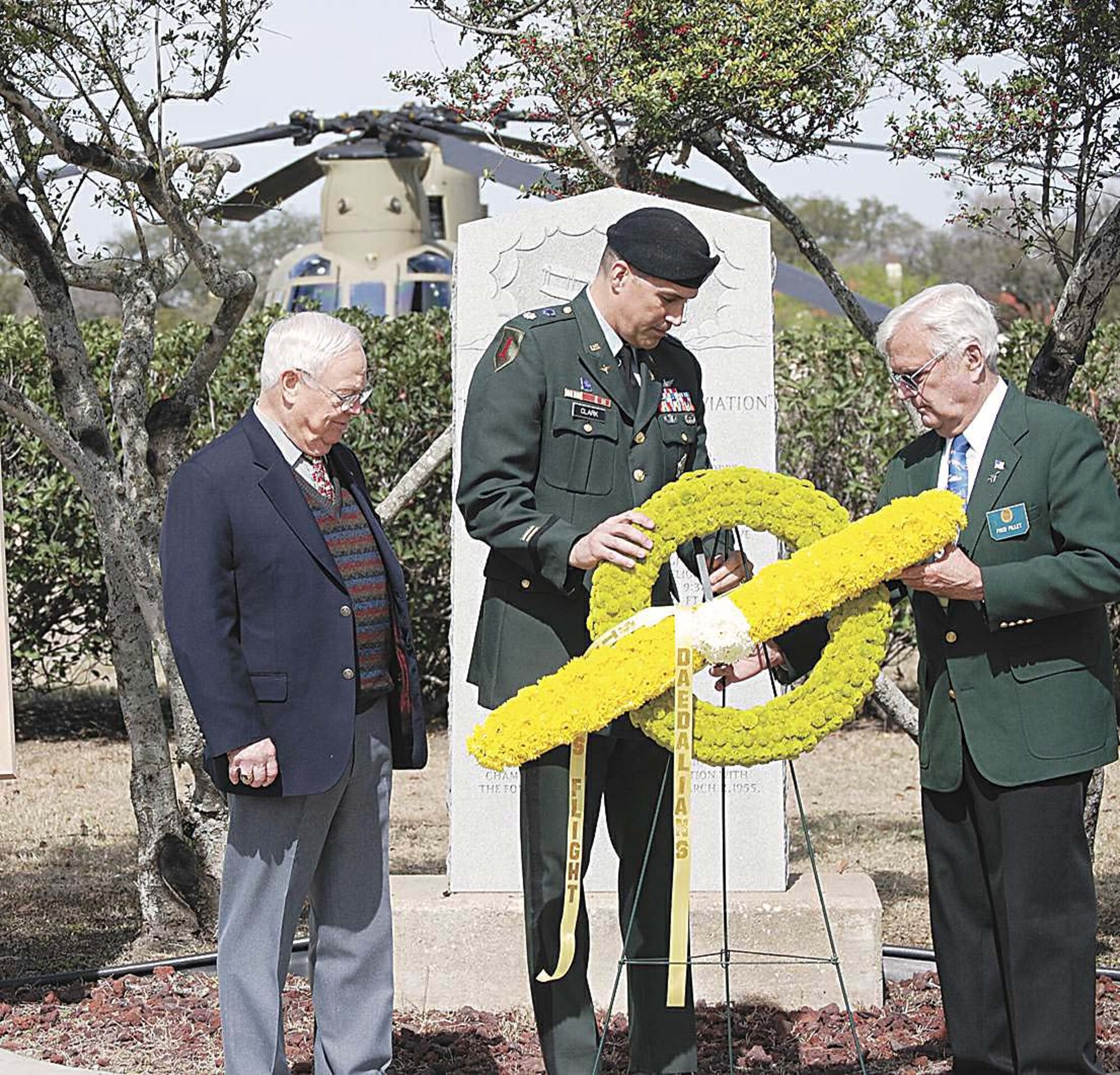 Keith Ferris (left to right), Lt. Col. Daniel Clark,and retired Col. Frederick Pillet place a wreath at the Foulois marker commemorating 99 years of the first military flight made by then 1st Lt. Benjamin Foulois. Mr. Ferris is an aviation artist, Colonel Clark is assigned to U.S. Army North, and Colonel Pillet is the acting flight Captain, Stinson Flight No. 2. (U.S. Army photo)
