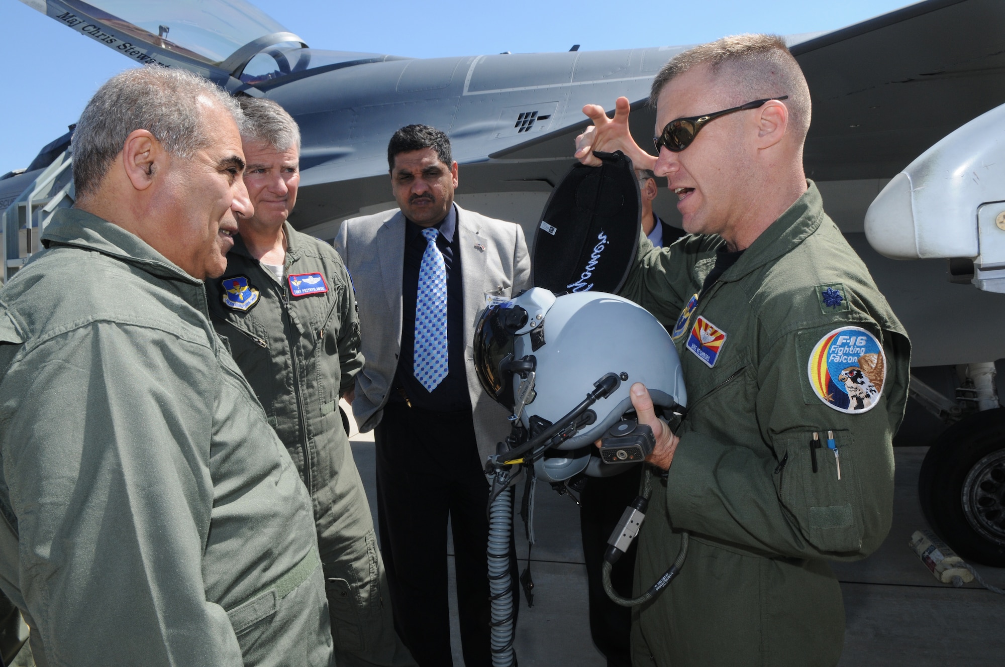 Lt. Col. Mike Neighbors, an F-16 pilot and director of operations for the 152nd Fighter Squadron, briefs Iraqi General Nasier Arkan Al-Abadi, Joint Forces Vice Chief of Staff, on equipment used by F-16 pilots. The general visited Randolph AFB March 4.