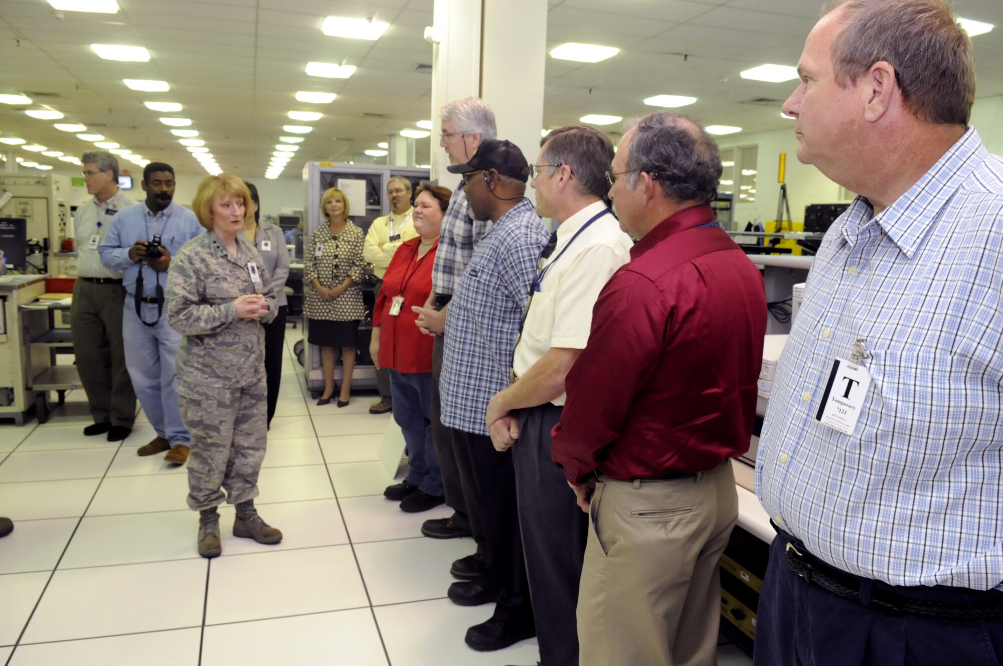 Maj. Gen. Polly A. Peyer, Warner Robins Air Logistics Center commander, talks to the team that formulated the IDEA to change lighted panel 6A8 to repairable. U. S. Air Force photo by Sue Sapp